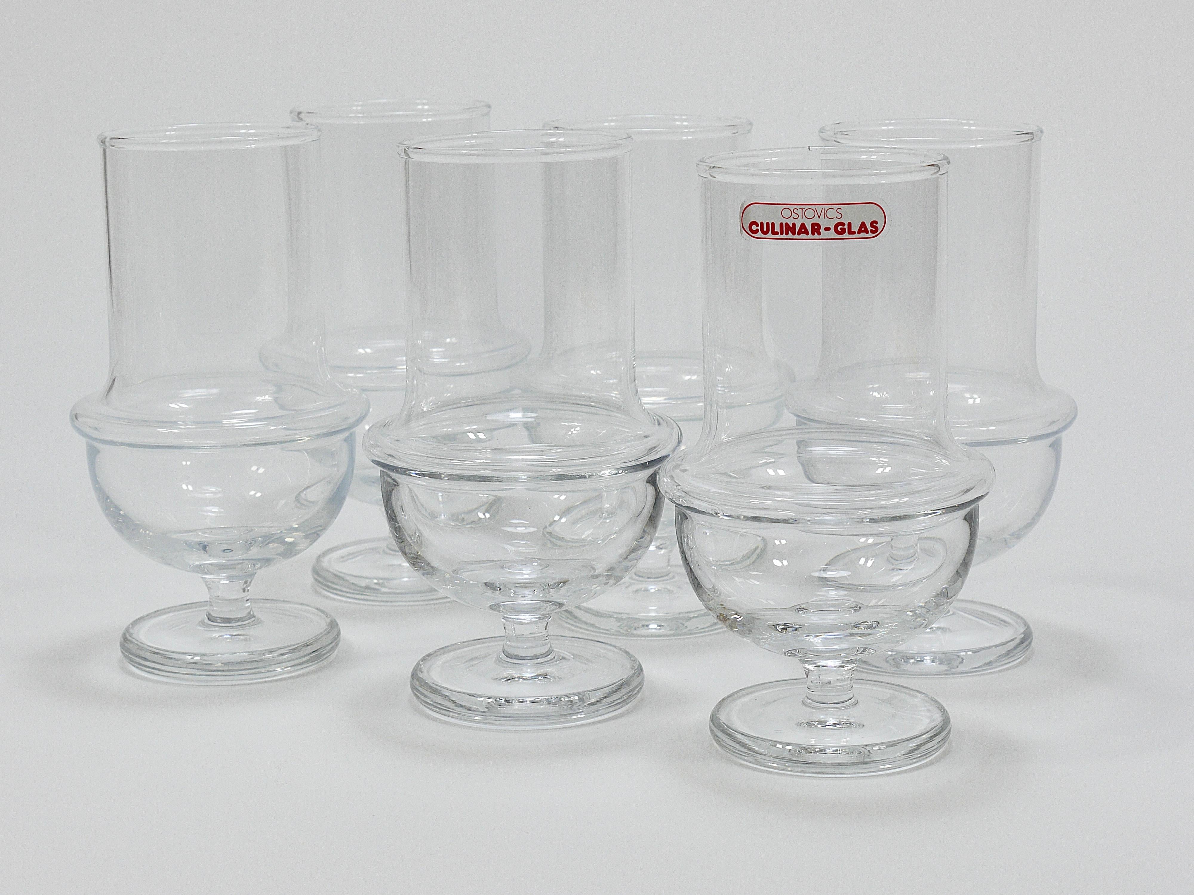 A set of six large, modernist stem drinking glasses from the 1970s, ideal for wine, beer, cocktails, water, or soda. Designed by Carl Auböck and crafted by Ostovics Culinar Vienna, these Austrian glasses are beautiful, unusual, and rare. They remain