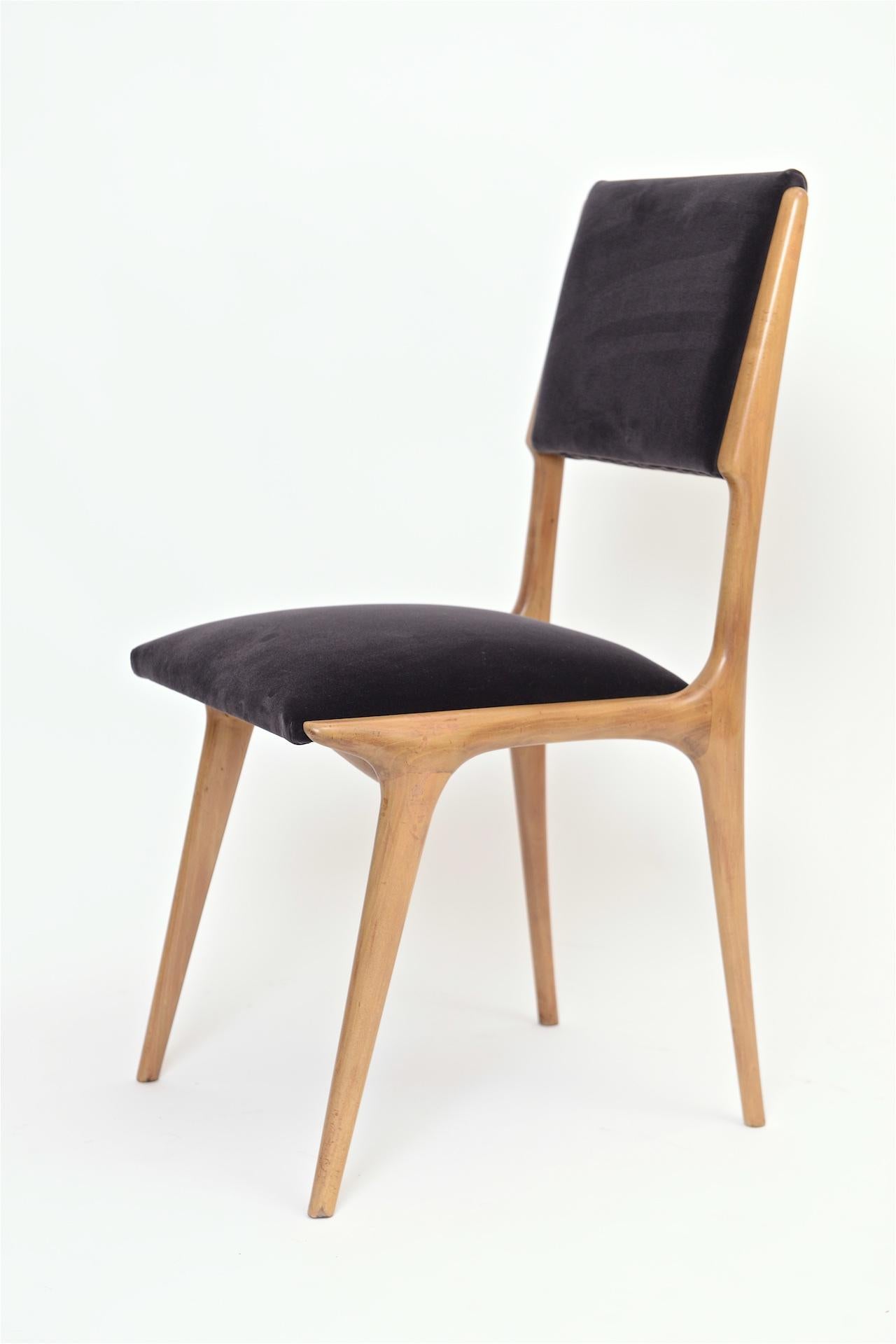 Early Carlo de Carli dining chairs in beech.

Restored and re upholstered in slate velvet.