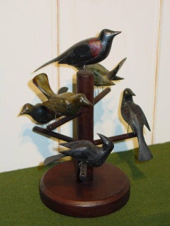 Six Carved and Polychrome-Decorated Pine Birds Mounted on a Tree