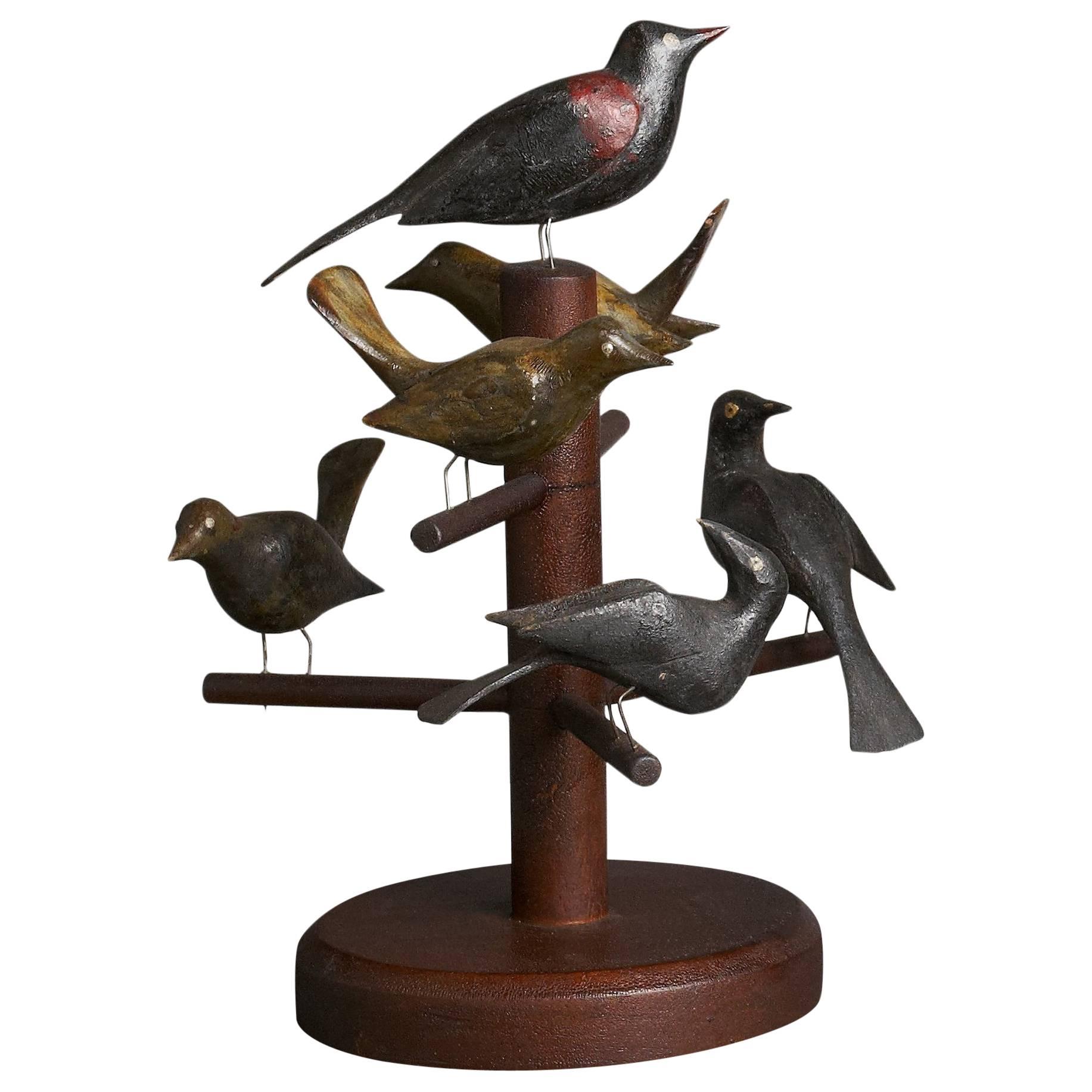 Six Carved and Polychrome-Decorated Pine Birds Mounted on a Tree For Sale