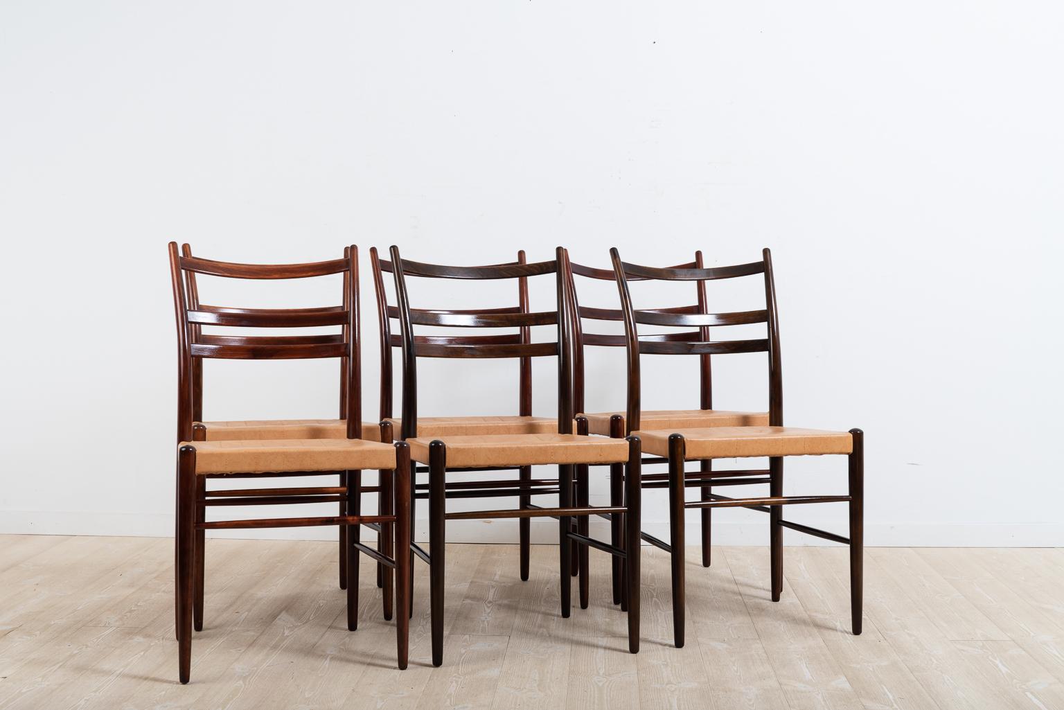 Six chairs designed by Yngve Ekström and manufactured by Gemla. The chairs are called Gracell and have wooden frames in stained beech and leather seats. The chairs were designed in 1956 and were sold until the mid-1960s before being relaunched in