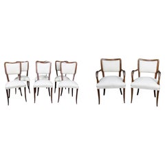Seis sillas con un par de sillones italianos del siglo XX