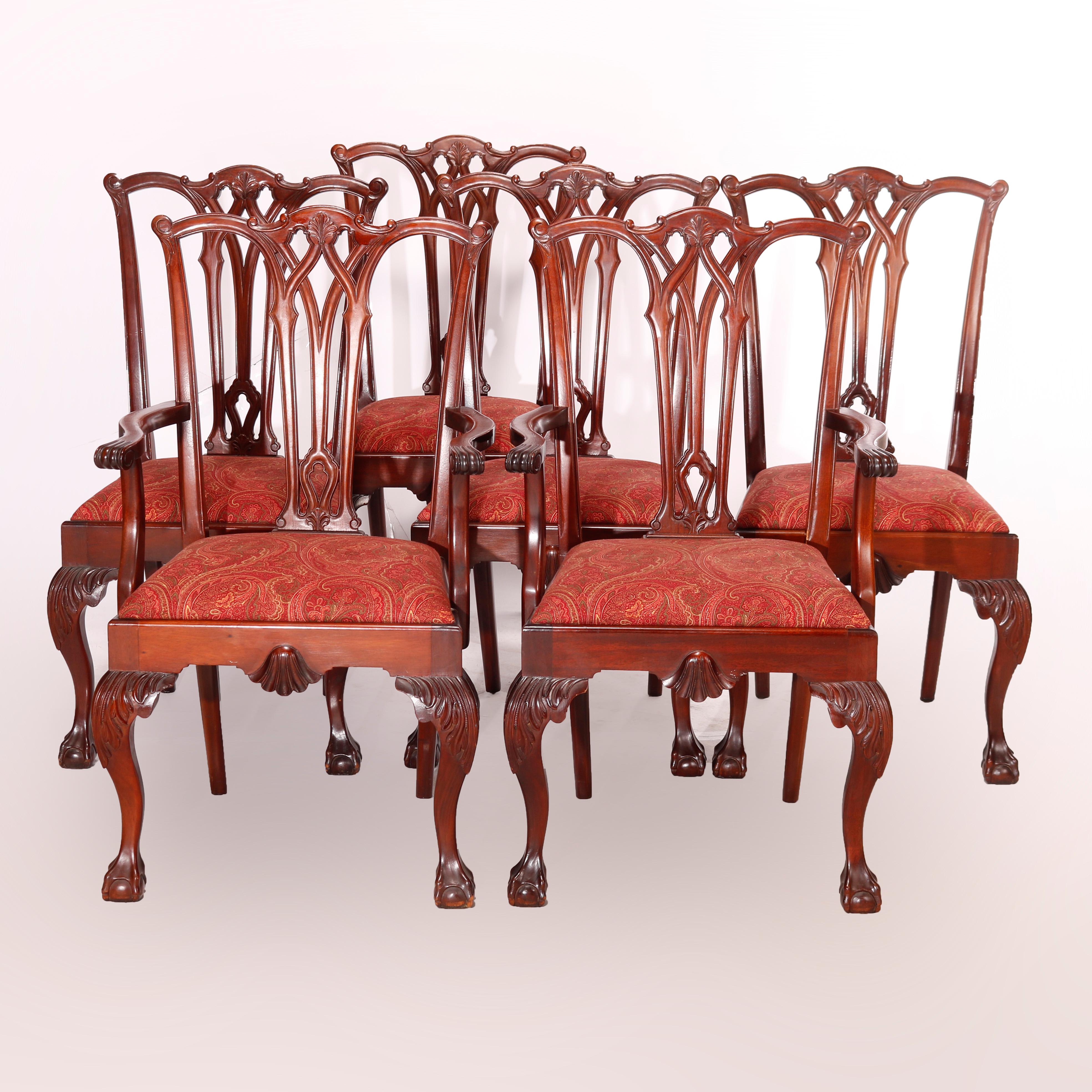 A set of six Chippendale style dining room chairs by Charak offer carved mahogany frames with ribbon backs over upholstered seats, raised on cabriole legs with carved acanthus knees and terminating in claw and ball feet, maker label as photographed,