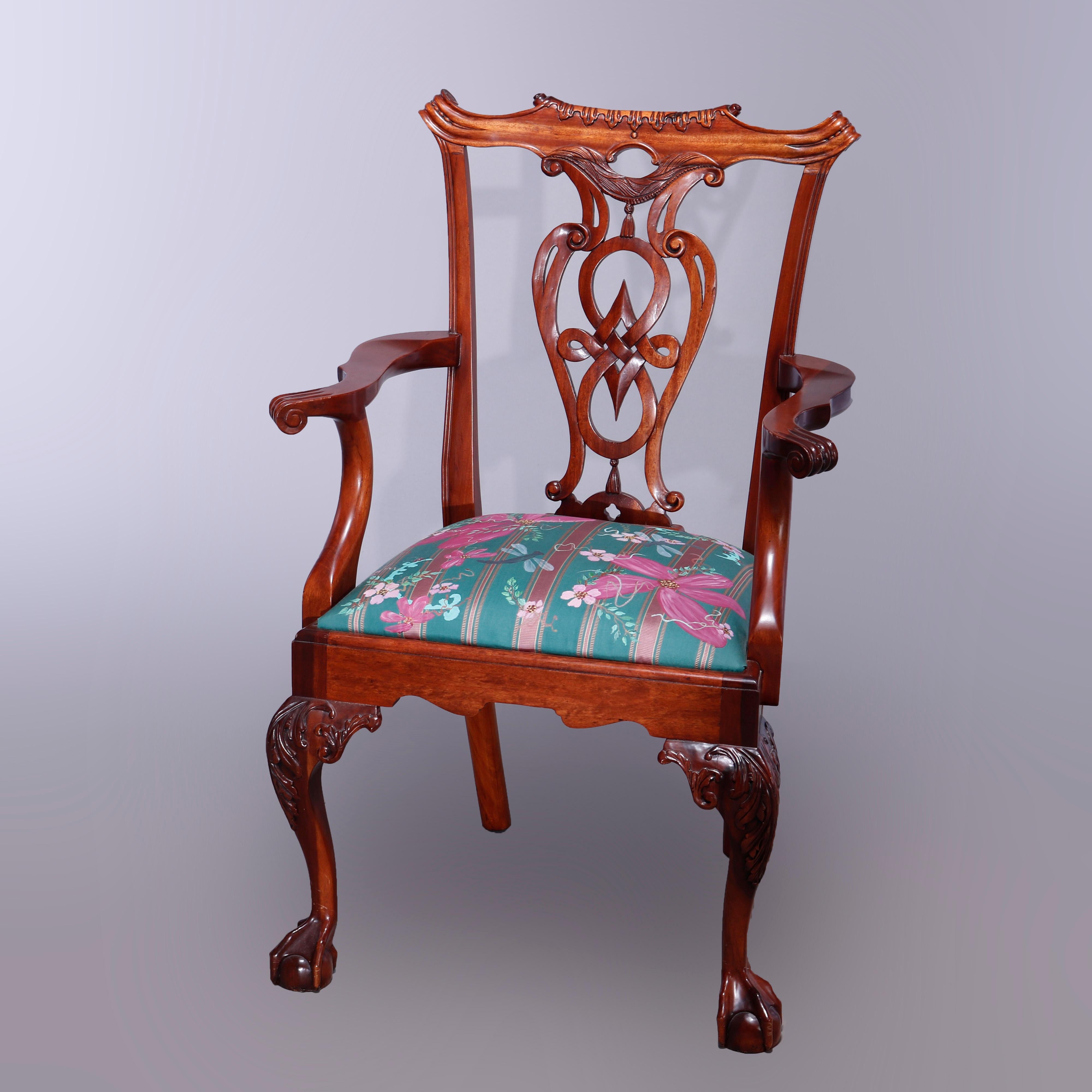 A set of six Chippendale style dining chairs offer mahogany construction with shaped rails over reticulated shield ribbon backs, raised on cabriole legs having carved acanthus knees and terminating in claw and ball feet, 20th century

Measures -