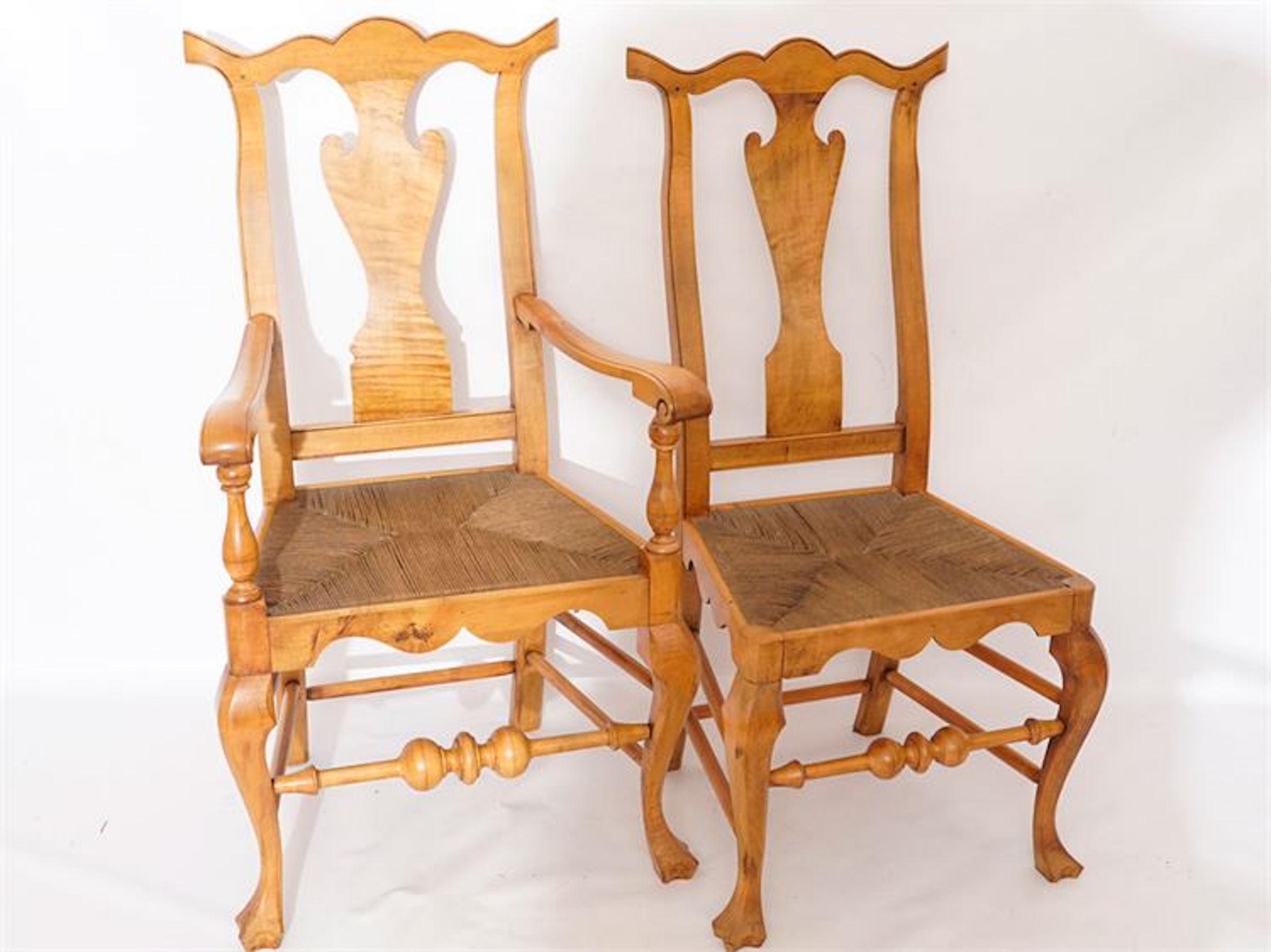 Six Chippendale style tiger maple dining chairs, cabinet made 20th century, consisting of 2 arm and four side chairs, subtly carved with fine details, raised on cabriole legs with pad feet.