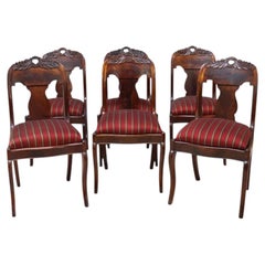 Six chaises de salle à manger Empire américaines classiques en noyer noir sculpté de feuillages c1840