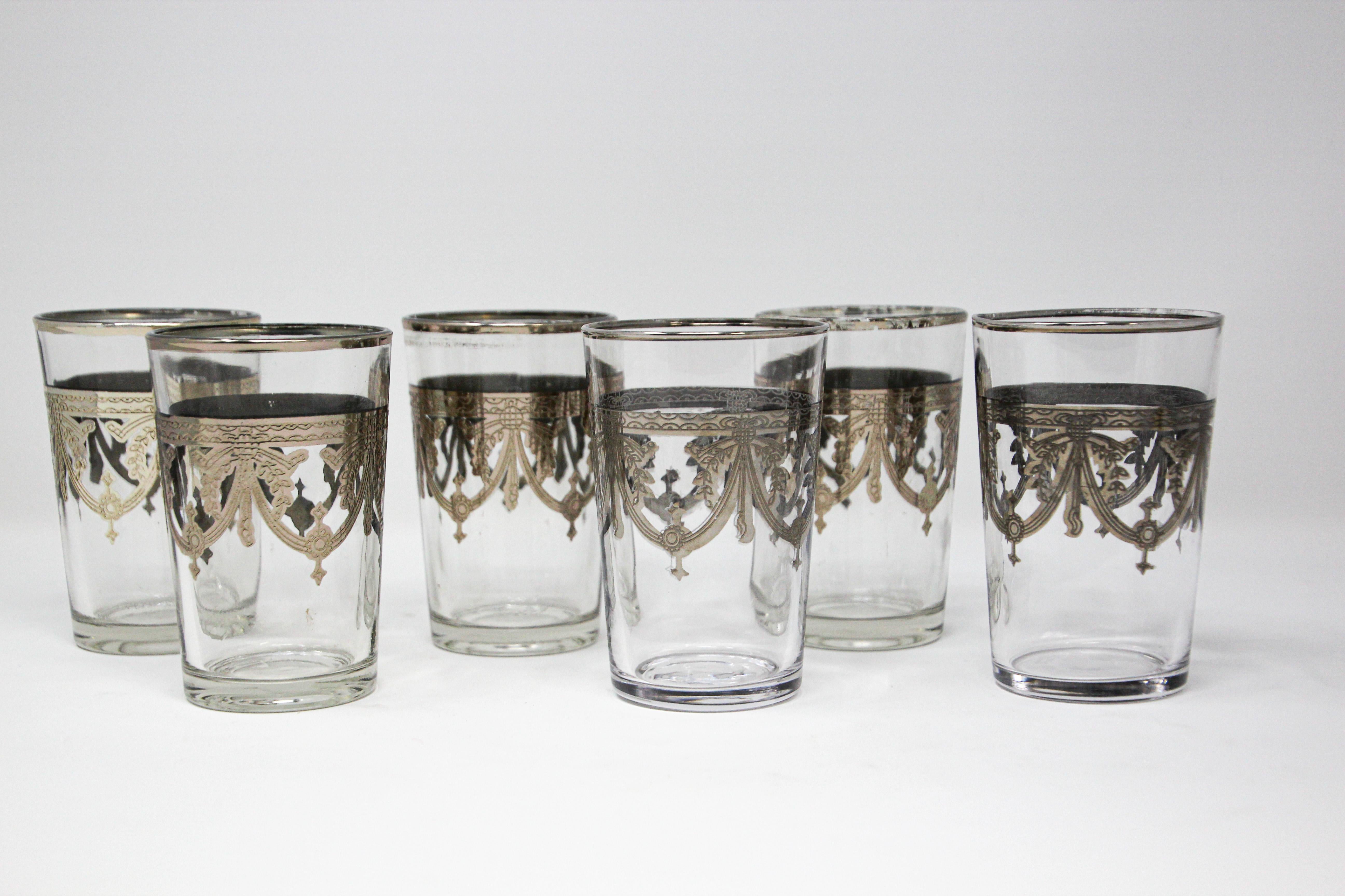 Moroccan Set of six clear and silver overlay Moorish style glasses.
Decorated with a classical silver pattern overlay frieze.
Use these elegant glasses for Moroccan tea, or any hot or cold drink.
In fantastic condition, perfect for the holidays and