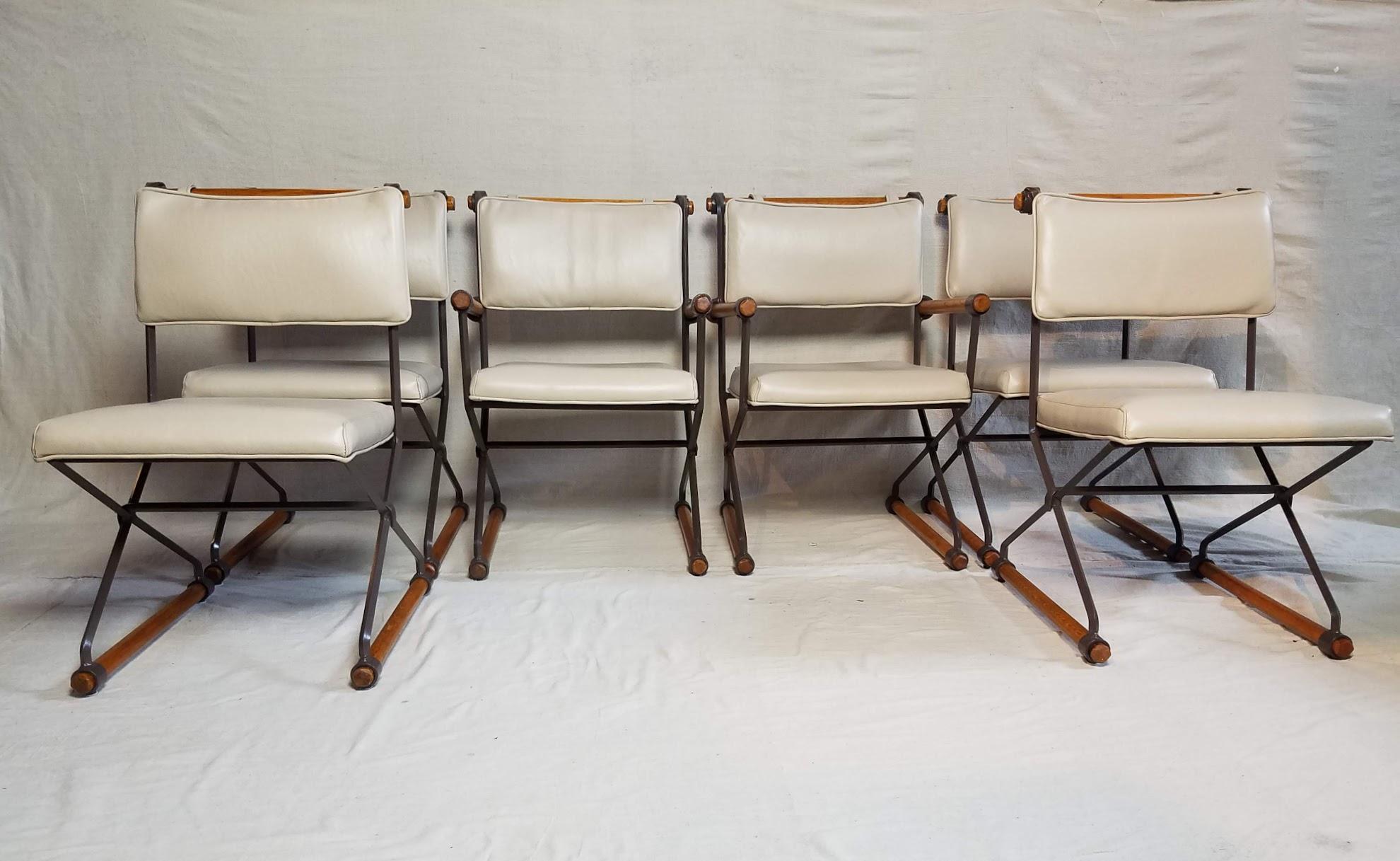 Six Cleo Baldon chairs from her Villa group manufactured by Terra in the mid-1960s thru the mid-1970s.
The wrought iron chairs are lacquered in their original warm chocolate color with fumed oak rods.
A variant of this chair was featured in the