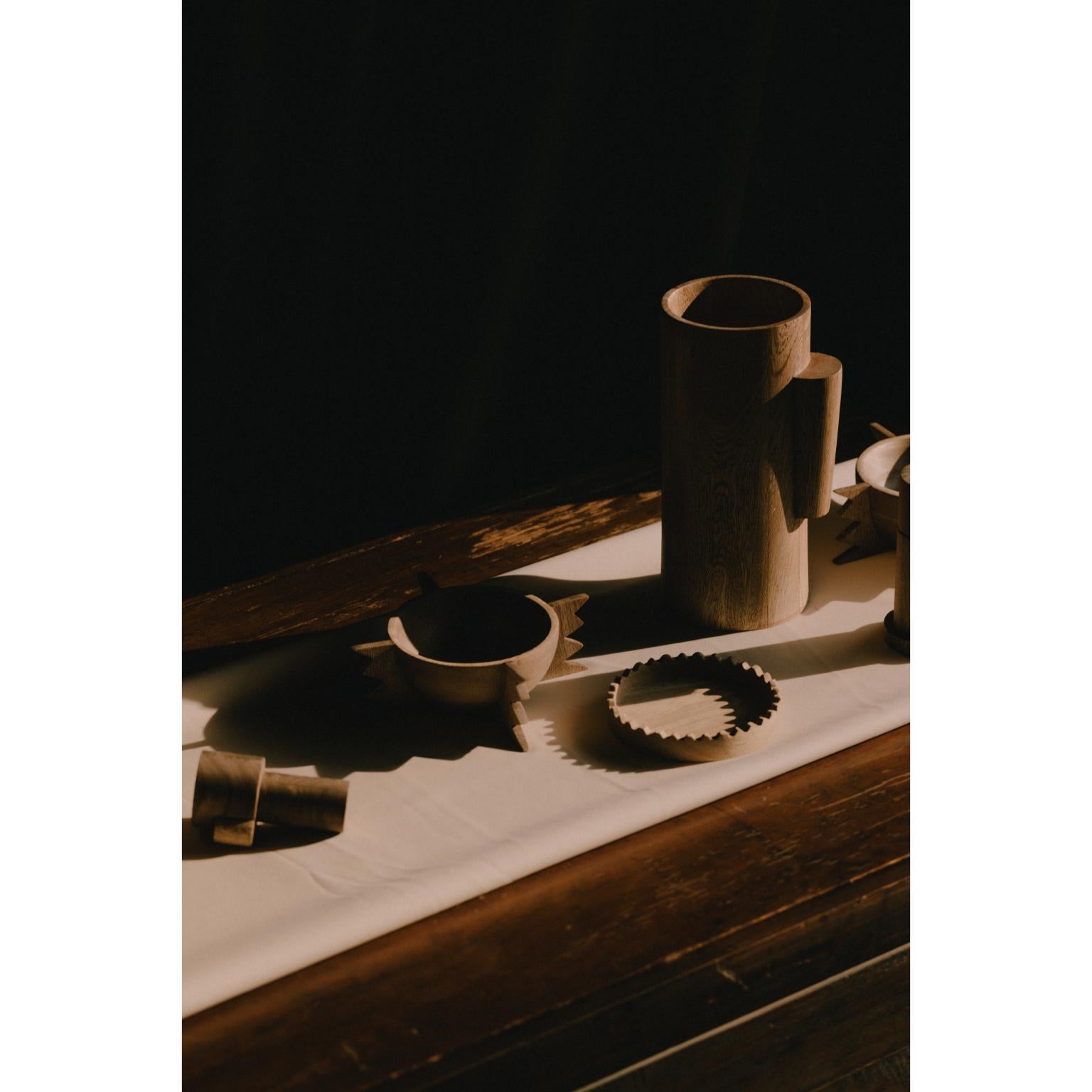 Six Cup Holder by Katia Solórzano
Dimensions: W 10 x D 10 x H 1.6 cm
Materials: Solid purple rose wood with mineral oil finishing.

SONORA TABLEWARE

A set of five objects with a design inspired by the state that bears its name. This work highlights