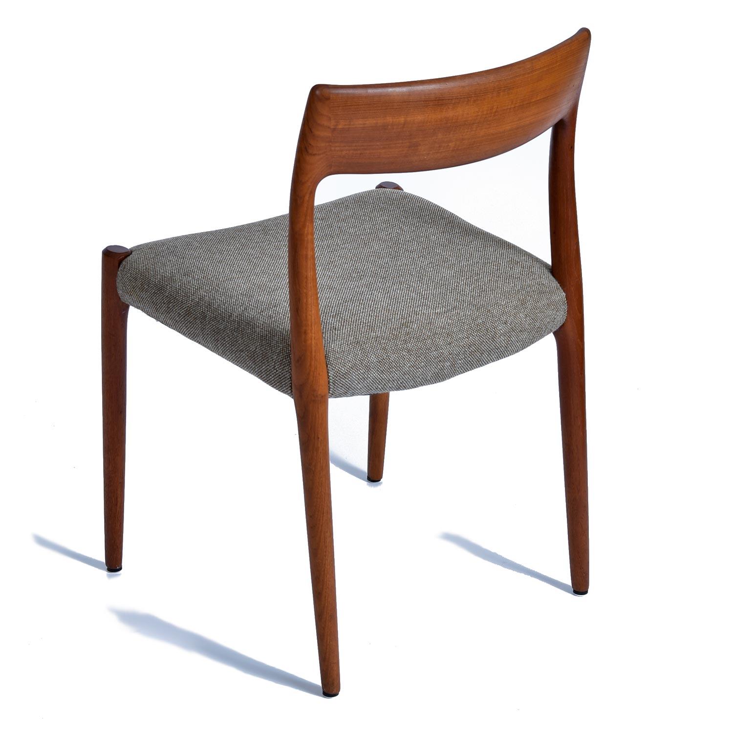 Six Danish dining chairs by Niels Otto Moller. These classics have become icons of Danish Modern design since their introduction by J.L. Moller. The set includes six model 75 chairs. All of the chairs feature newer fabric in excellent condition that
