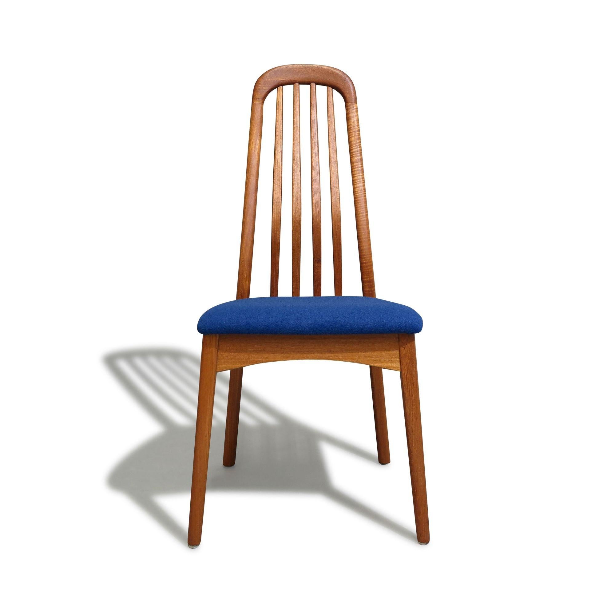 Six solid teak dining chairs crafted of solid teak with angled, slatted back rests, which offers comfortable lumbar support. Newly upholstered in blue wool textile seats . The chairs are fully restored in excellent condition with minor signs of age