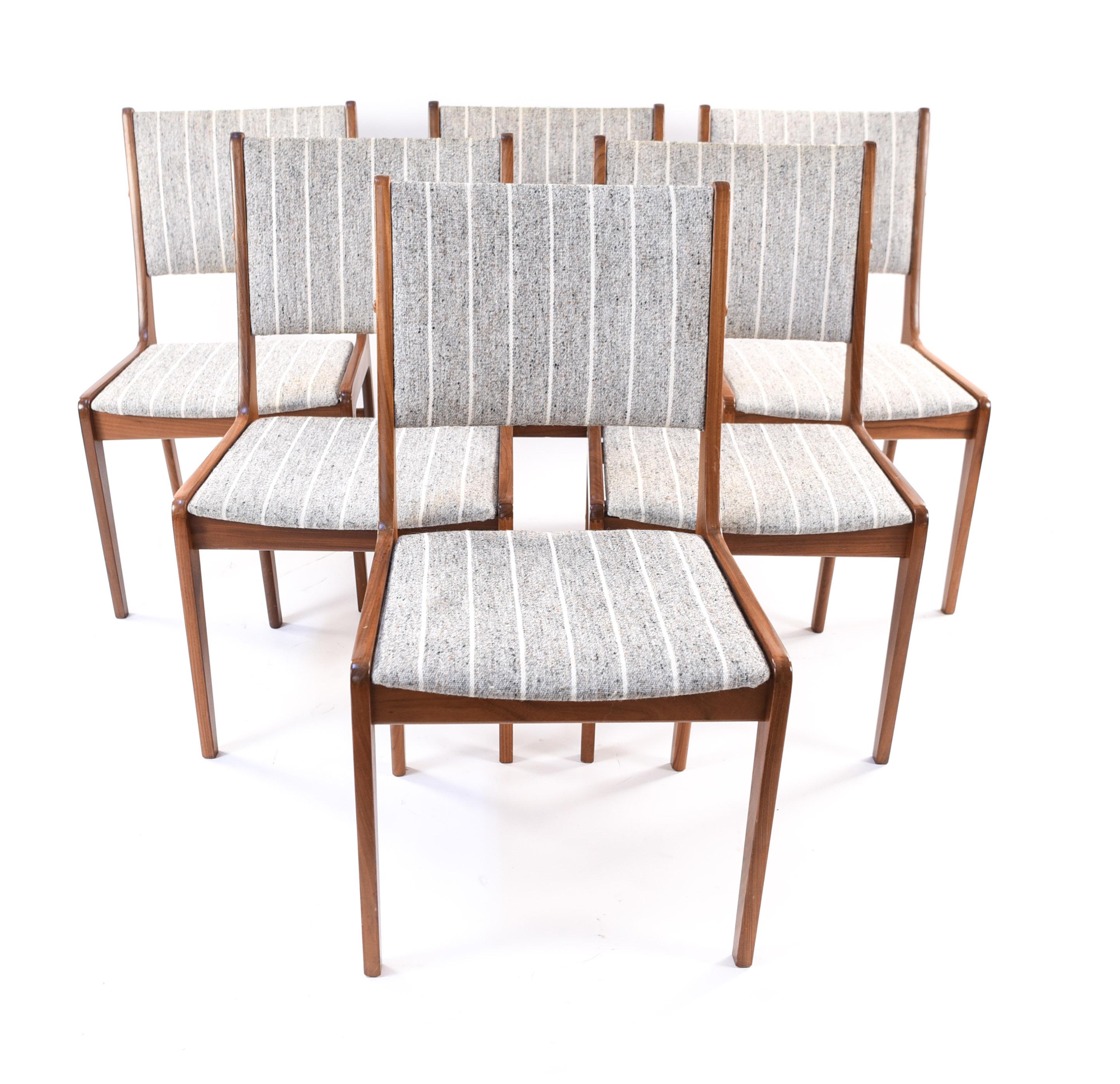 A set of six Danish midcentury Fastrup dining chairs in model 7701 by Sax. With simple, pleasing frames of teak and neutral colored striped upholstery. The perfect set to fit around your dining table!