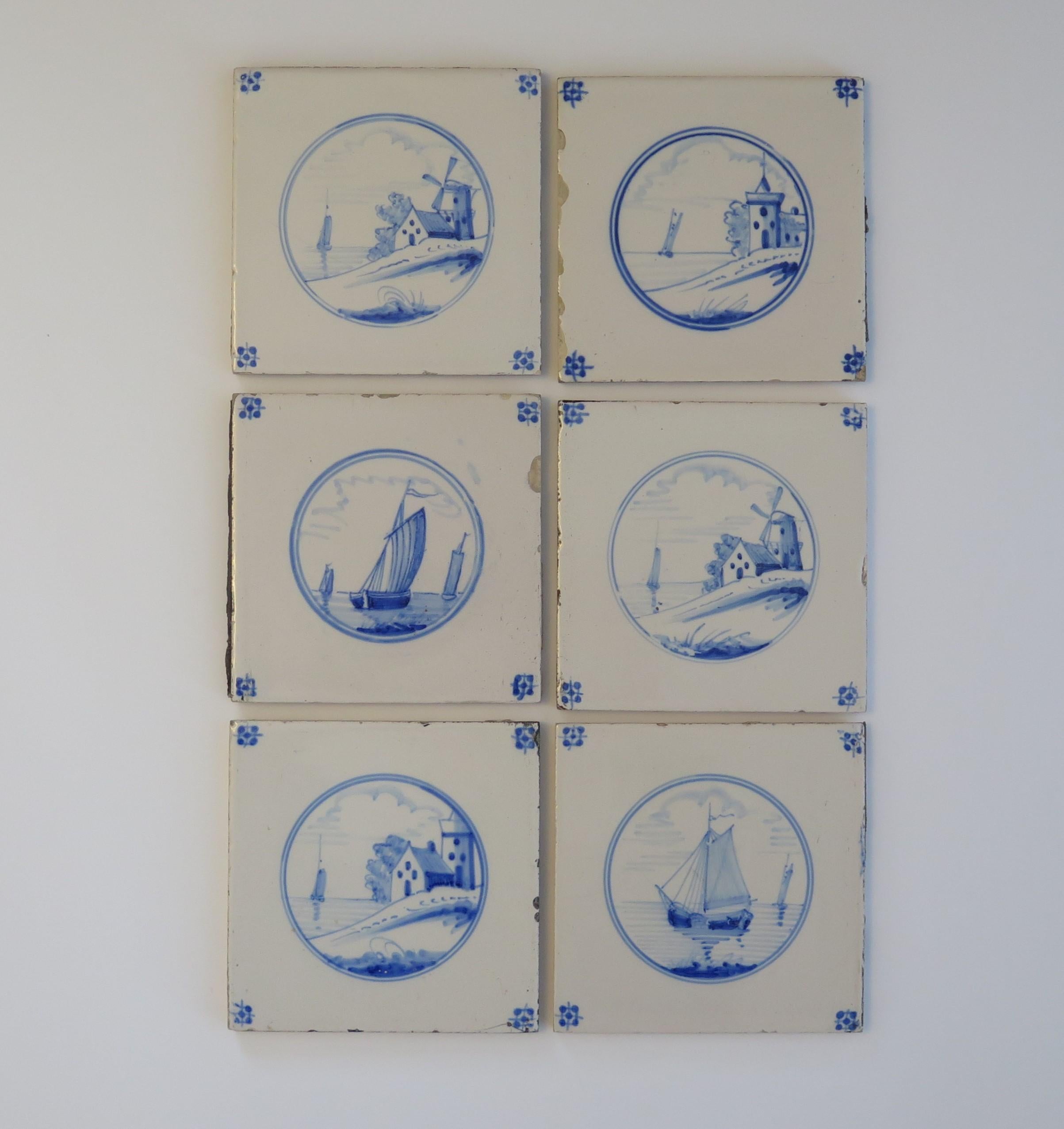 These are Six Delft wall tiles, all with hand painted blue and white waterside landscape scenes, made in the Netherlands during the 19th century.

The tiles are ceramic, made of earthenware and nominally about 5.2 inches square.

The set of Six