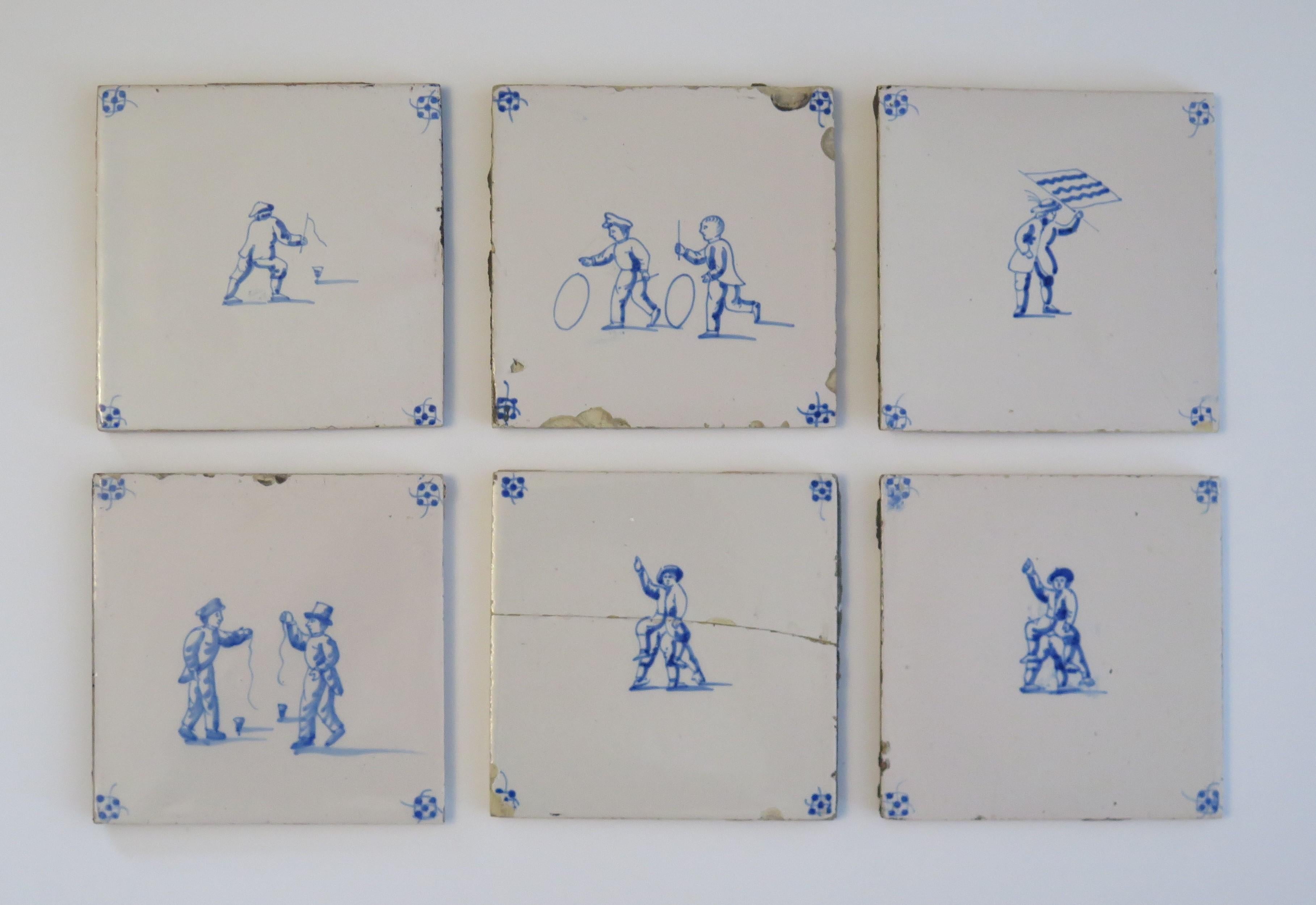These are a set of six Delft wall tiles, all with hand painted blue and white scenes of Children playing different games, made in the Netherlands during the 19th century.

The tiles are ceramic, made of earthenware pottery and nominally about 5.2