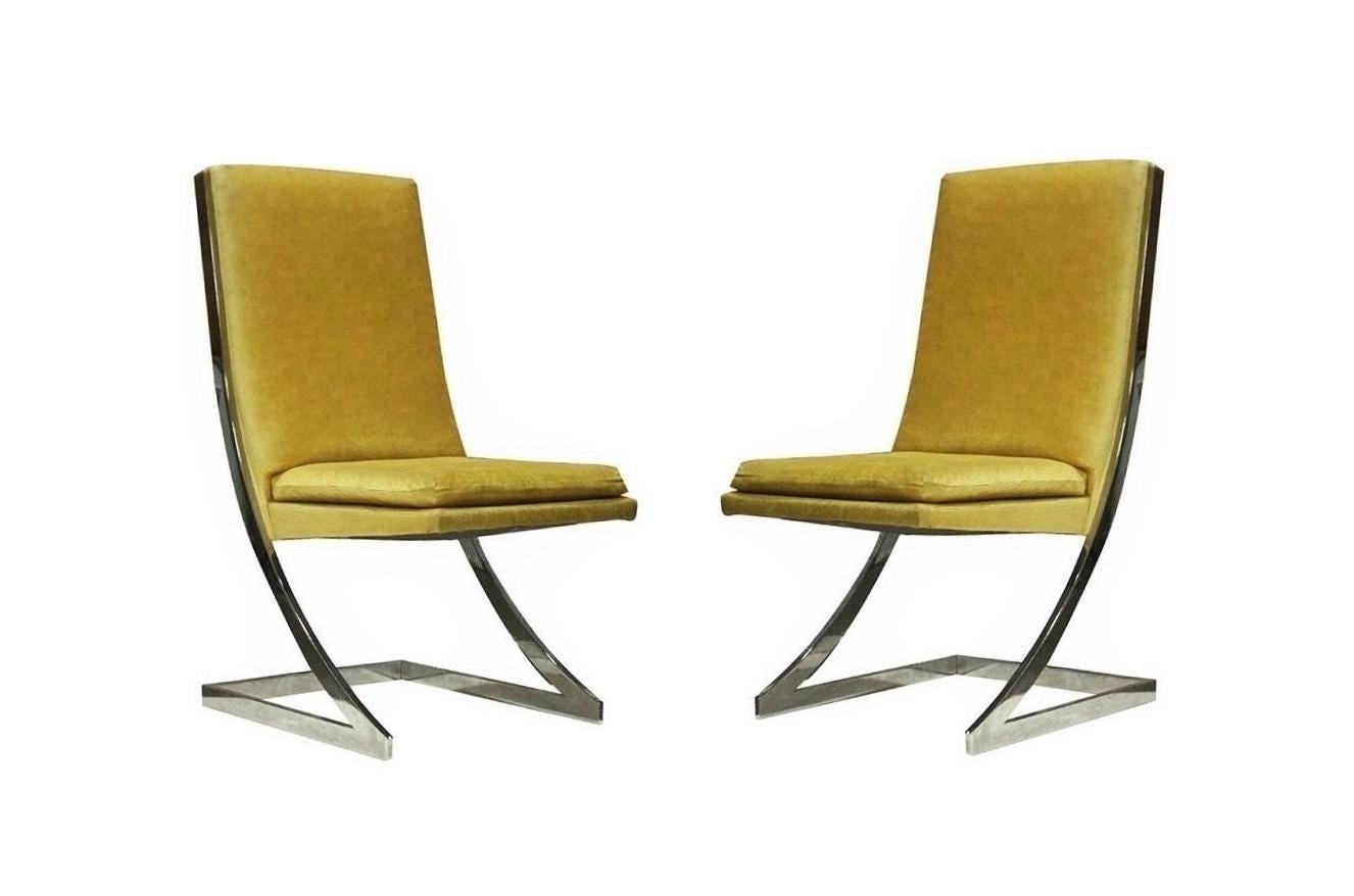 Exceptional set balancing exquisite design with comfort. Made in the USA by Design Institute America. Set of six featuring cantilevered dining chairs constructed of flat bar chromed steel Z-frames and high backs professionally upholstered in a