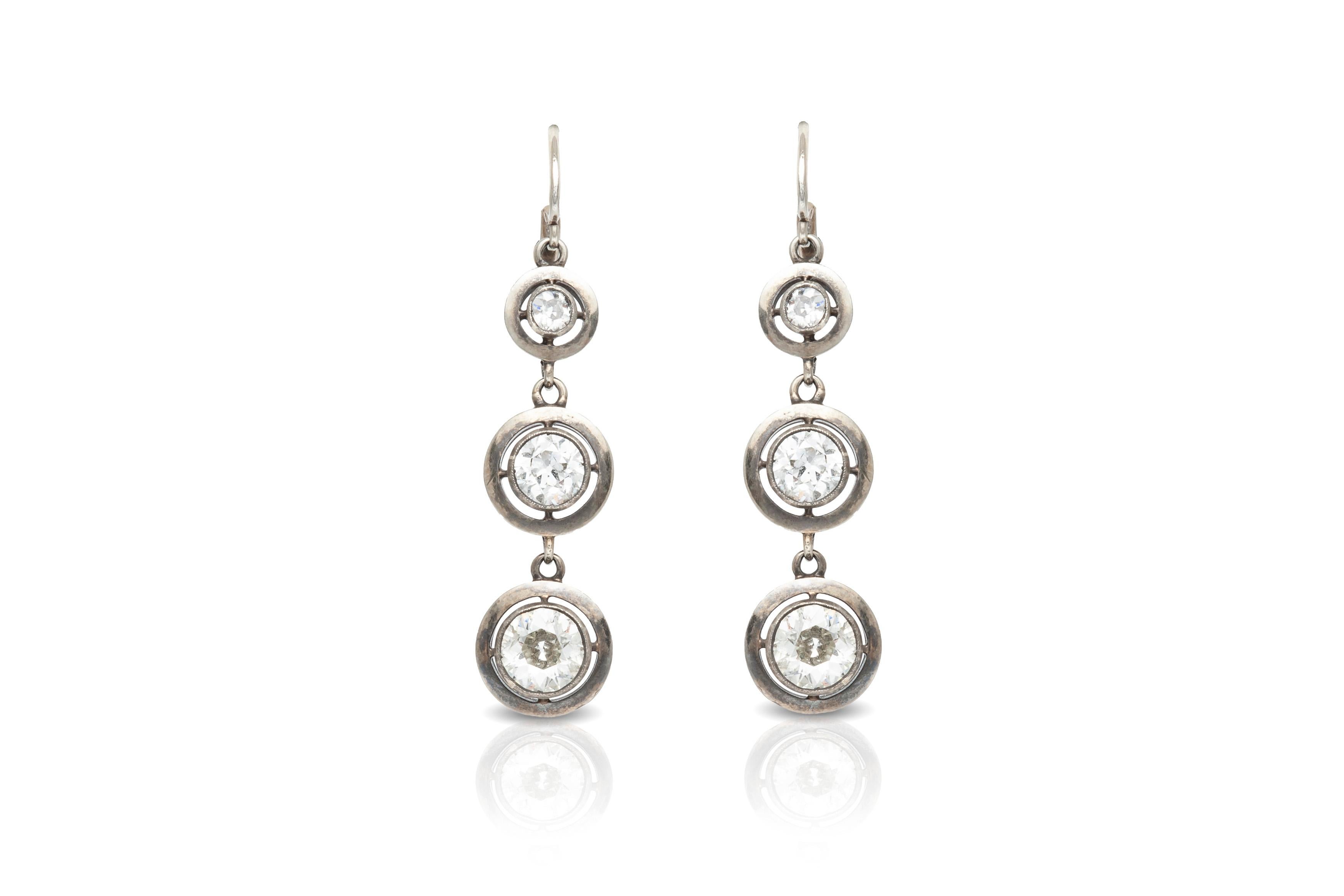 The earrings is finely crafted in 18k with diamonds weighing approximately total of 3.00.