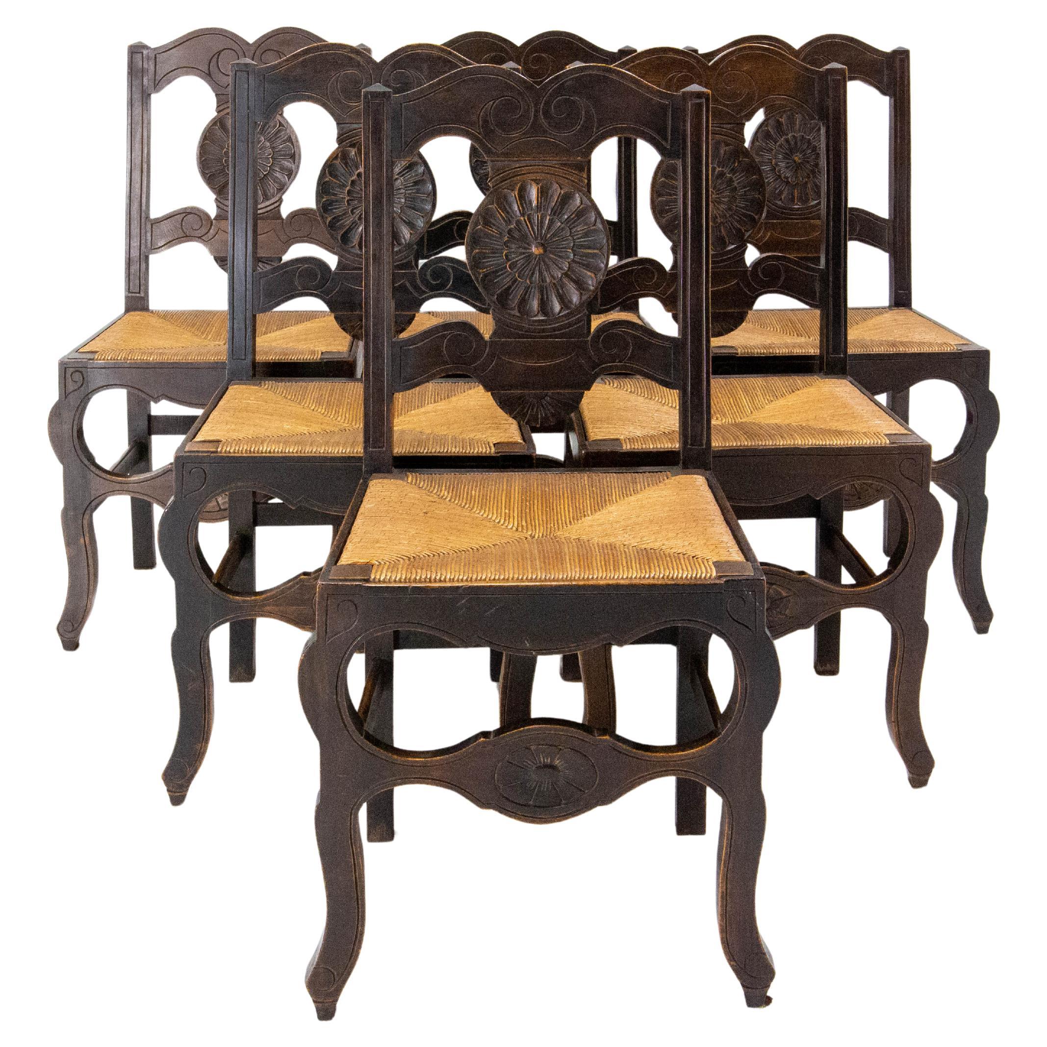 Handsome set of six chairs
Chestnut, leather and iron studs.
The leather seats are all reinforced with upholsterer's straps. The leather covering one of the chairs was torn, so straps were added underneath the seat and a seam was sewn for purely