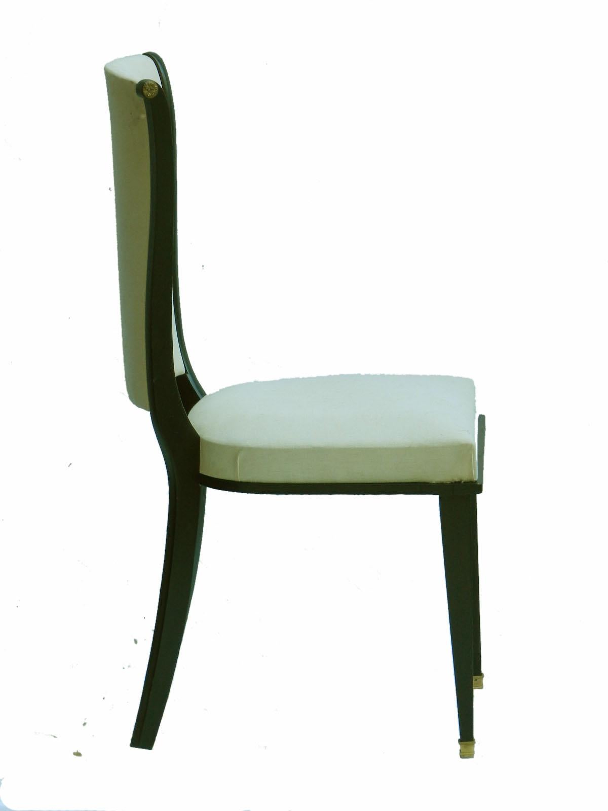 Six dining chairs Art Deco Empire revival French, circa 1940-1960 Mid Century manner of Andre Arbus 
Upholstered and ebonised wood
With brass feet and side roundels
These will be sent covered to 'calico' undercovers ready for top covers 
Or if you
