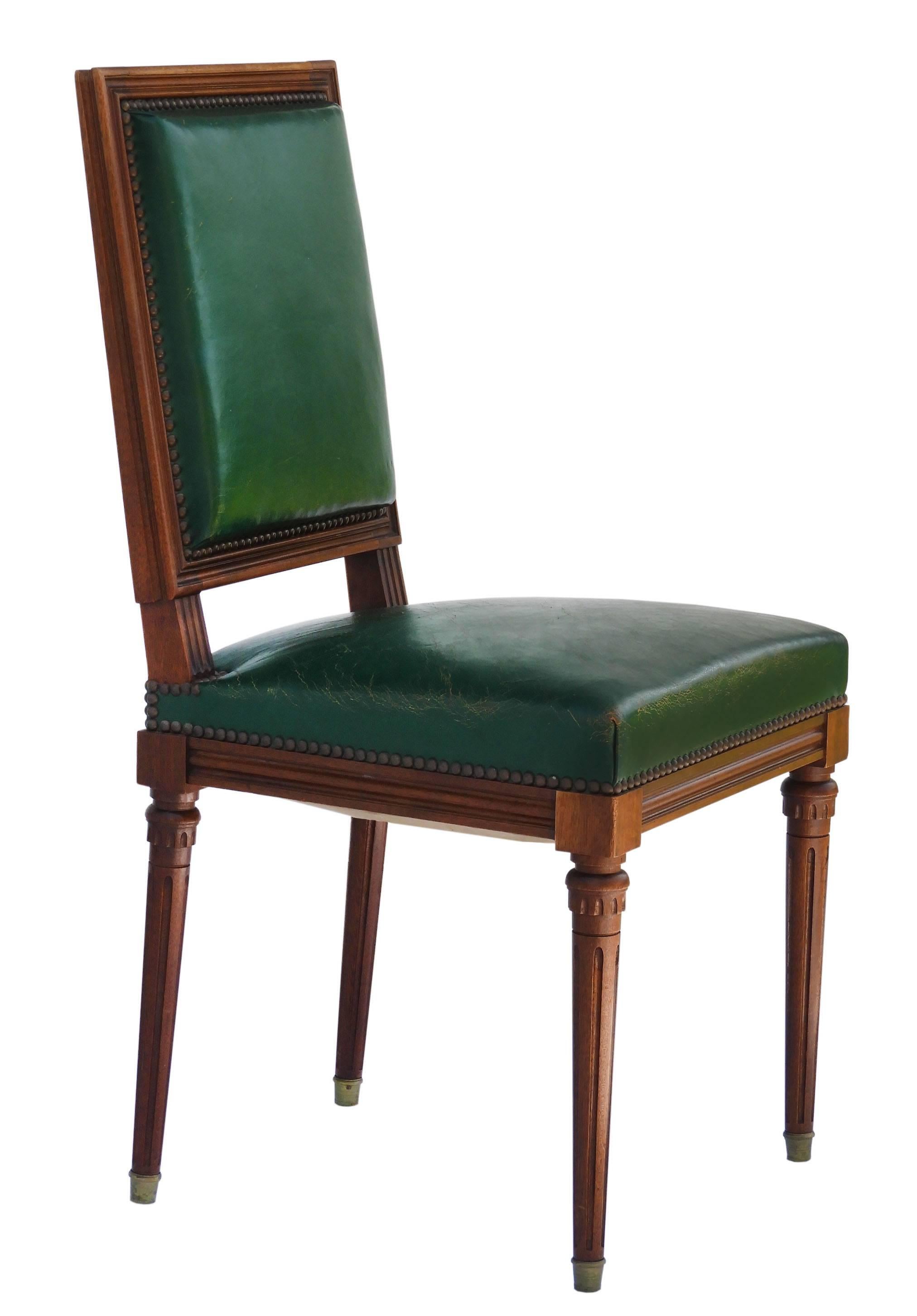 Set of six French dining chairs, early 20th century Louis XVI revival original dark green studded upholstery.
In good condition solid and sound with worn leather good patina and very comfortable
Some marks of use and one small loss to the wood at
