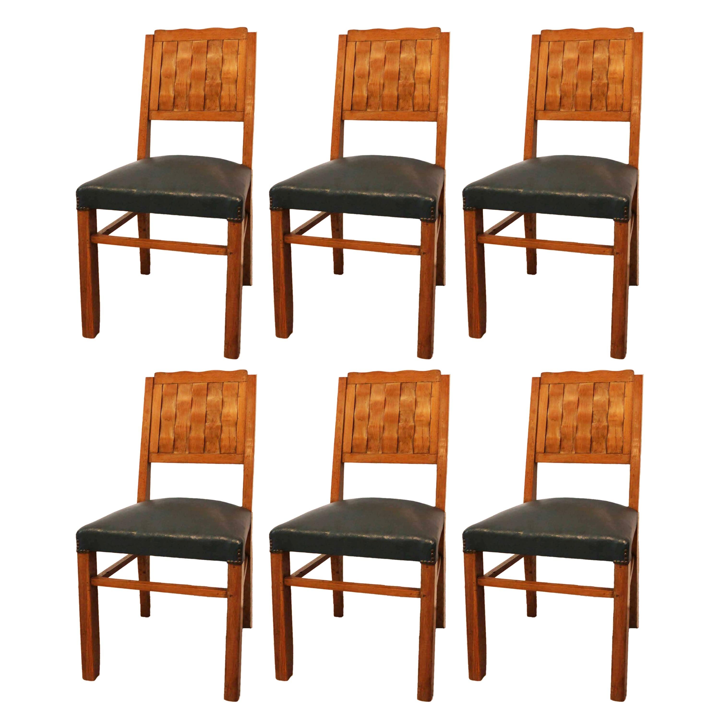 Six chaises de salle à manger Français du milieu du siècle, circa 1950