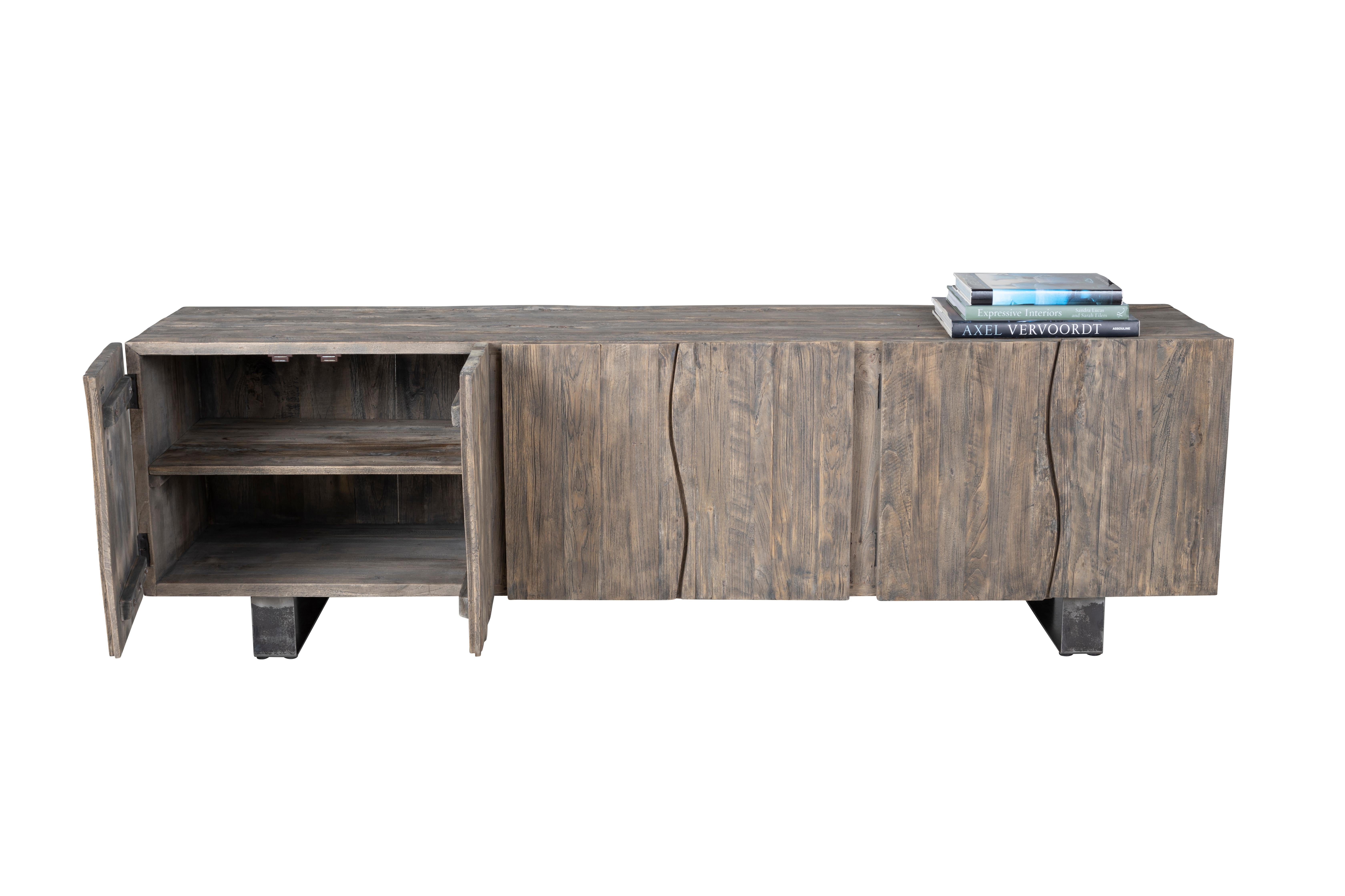 Made of solid wood this six-door server is a modern-day antique with an original grey tone patina—a sophisticated touch for your dining room. This server showcases six door compartments in a minimalist fashion. The sleek simple front creates