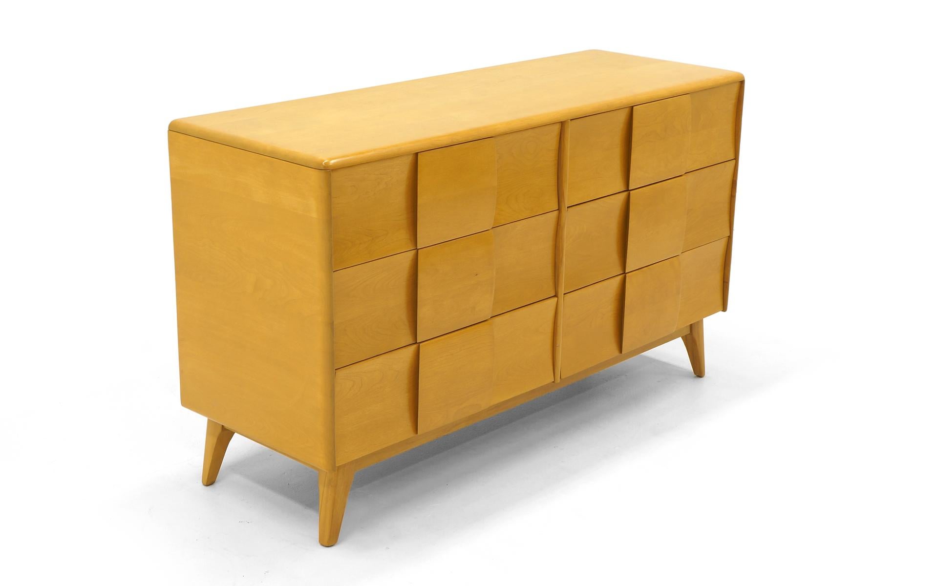 Heywood Wakefield six-drawer dresser in Champagne finish. The Sculptura line is the only Heywood Wakefield designs we buy and sell. Striking looks and great functionality. Solid birch construction. We have a listing for the same dresser in wheat