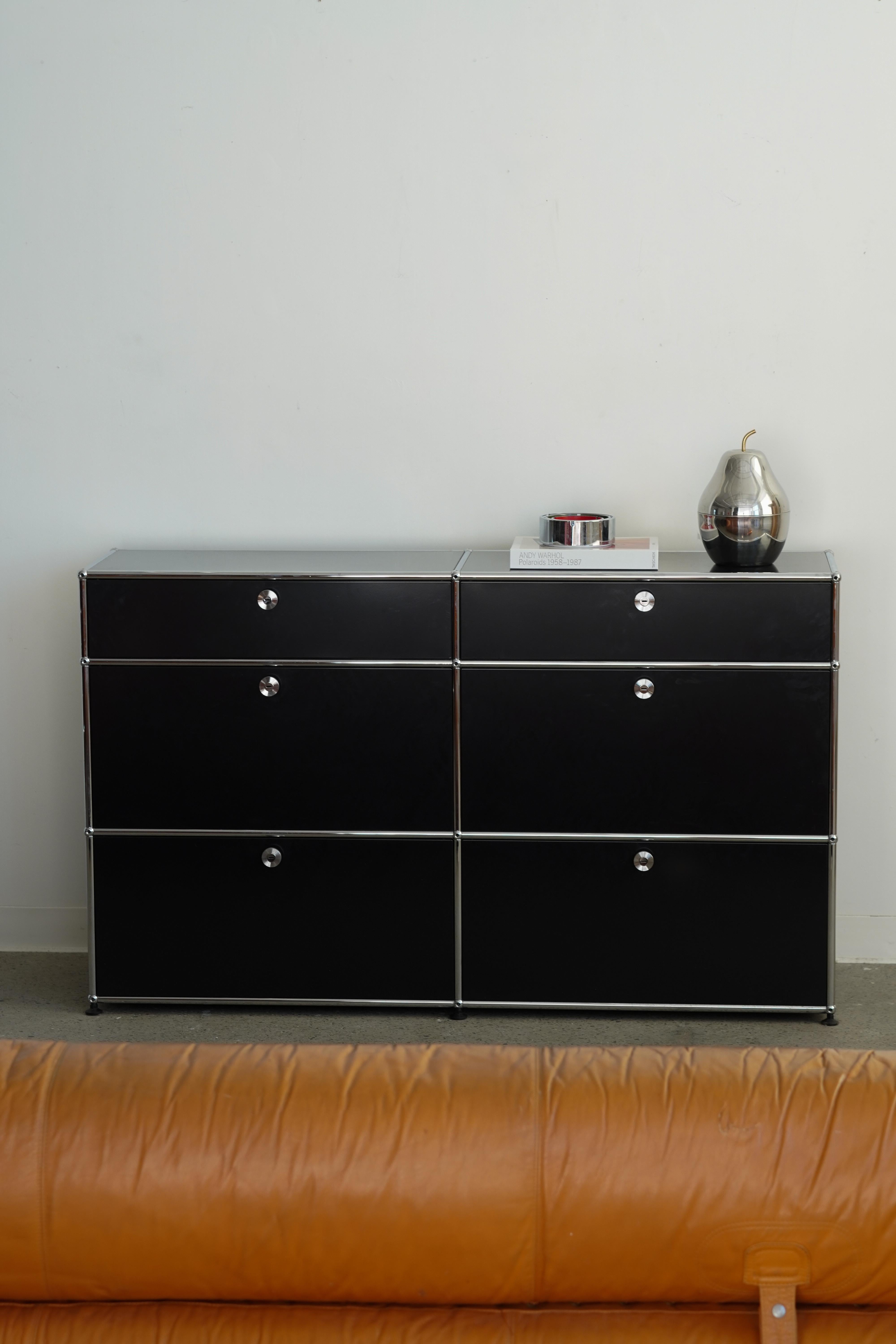 Black Six Drawer Storage Unit by Fritz Haller and Paul Schaerer, made in Switzerland. Powder-coated steel and chrome-plated steel tube framing. The top and bottom drawers are sliding, and the middle is drop-down drawers. The USM Haller system has