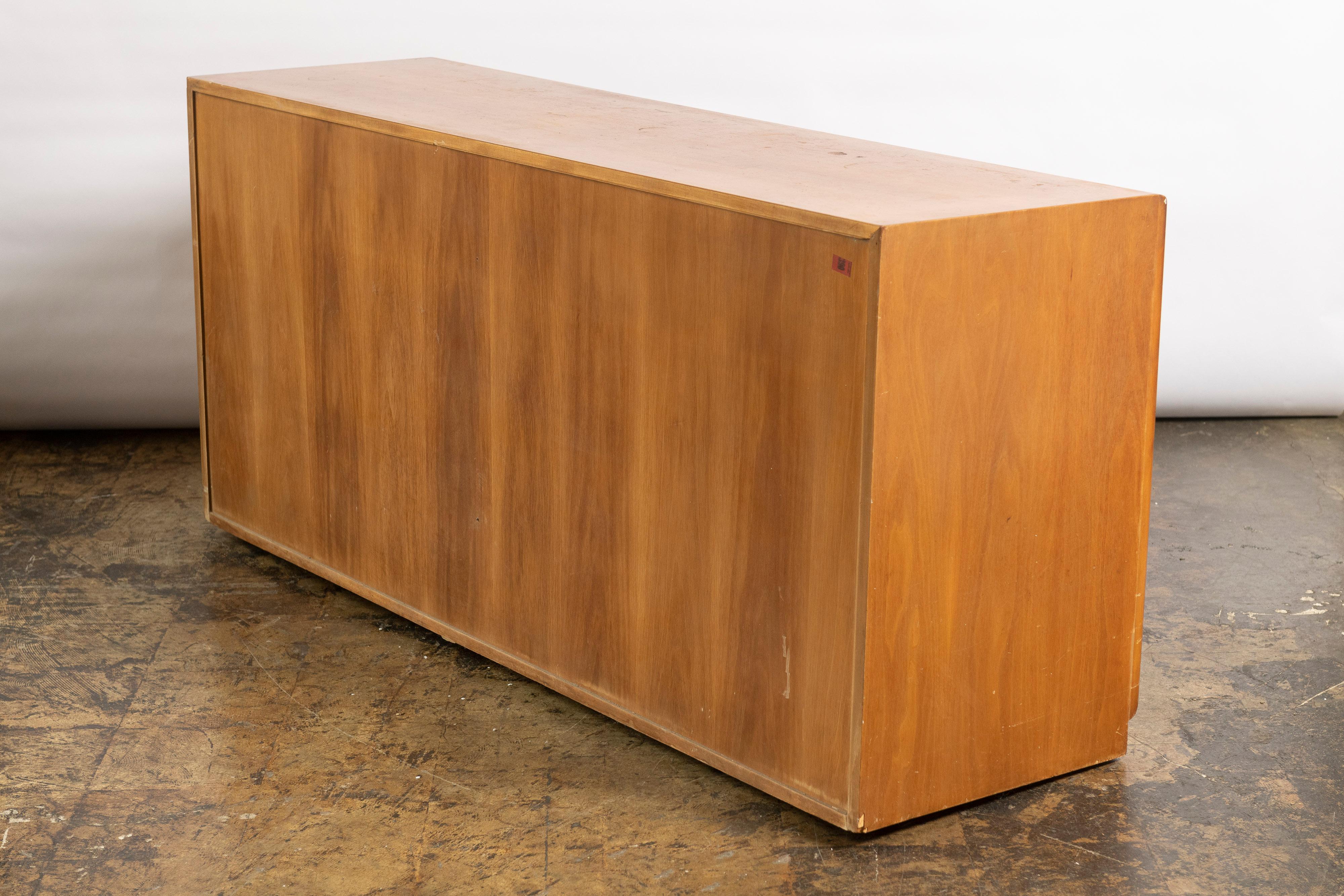 Great six drawer double dresser/credenza designed by T.H. Robsjohn Gibbings for Widdicomb Furniture in teak. The chest features two banks of three drawers, including dividers in a couple drawers, providing generous, organized storage space. The