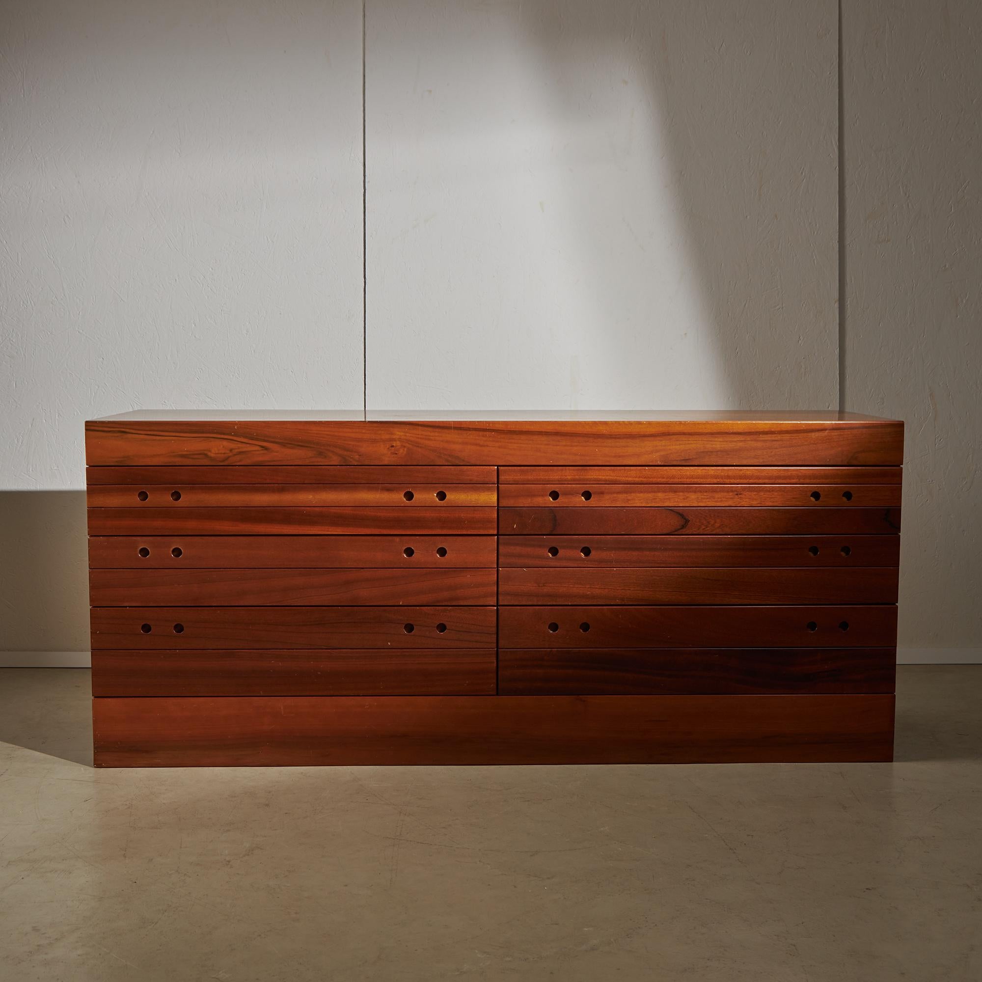 Take a moment to look at this six-drawer walnut sideboard. This sideboard is a piece of furniture that combines style and function in a practical way. It has six drawers that can be used for storage, making it useful for keeping your items