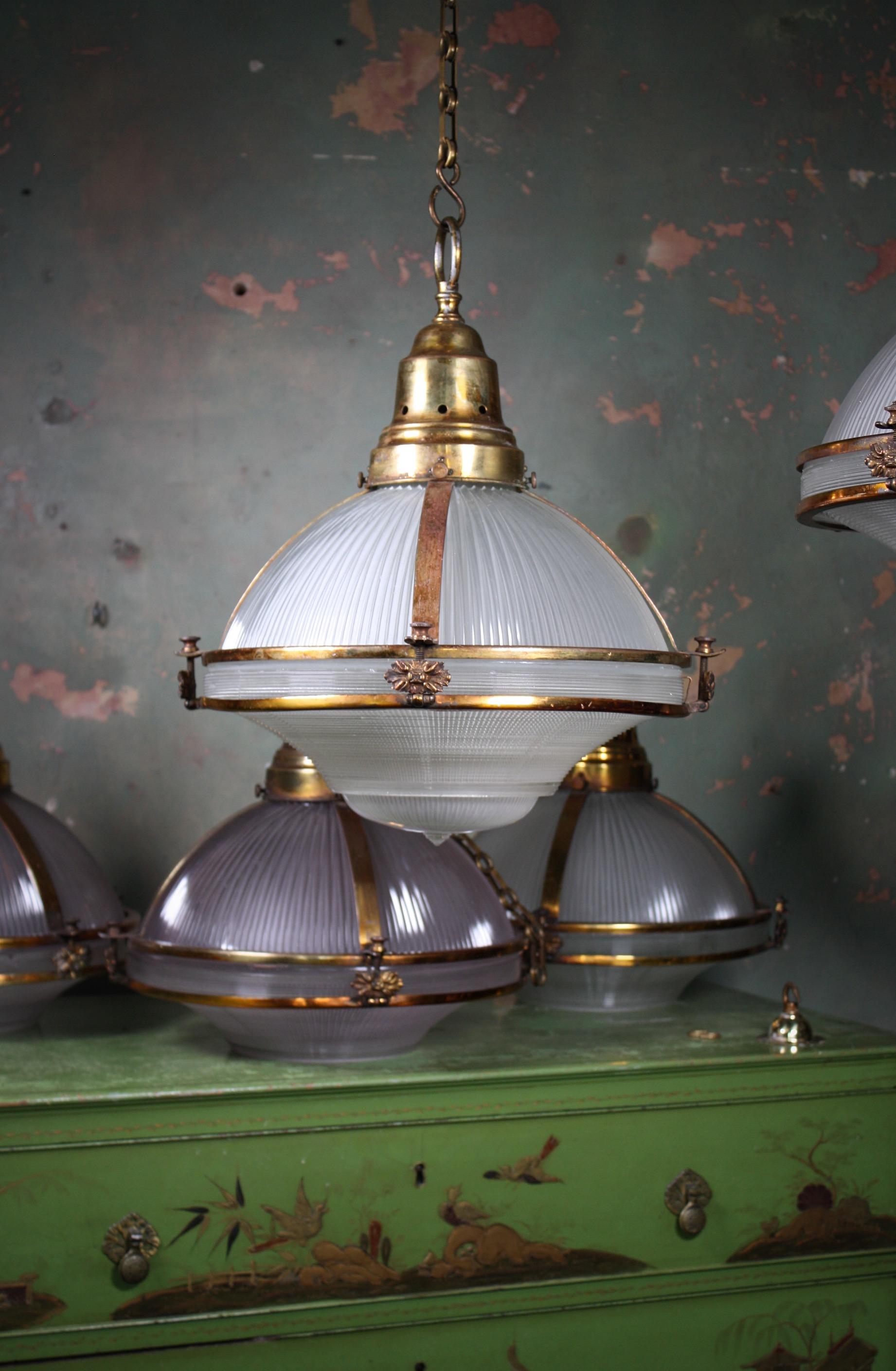Brass Six Extra Large Holophane Prismatic Glass and Copper Gilt Caged Pendants Lights
