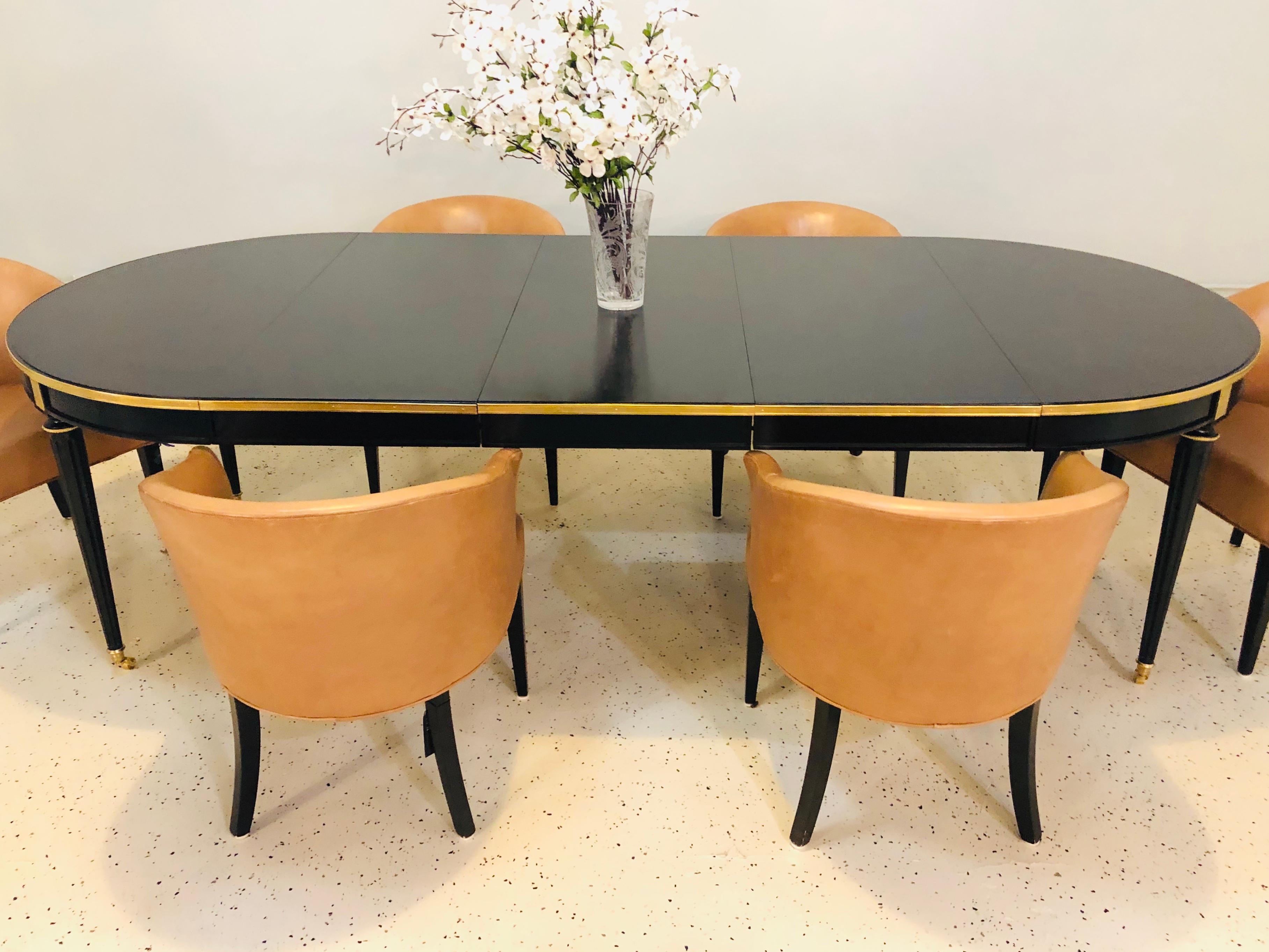 Six Edward Wormley dining chairs. Mid-Century Modern leather upholstered dark stained wood dining chairs. Five linen chair covers are included. Can purchase as many as are needed. Price is for the set. Five having a nice custom linen slip cover in