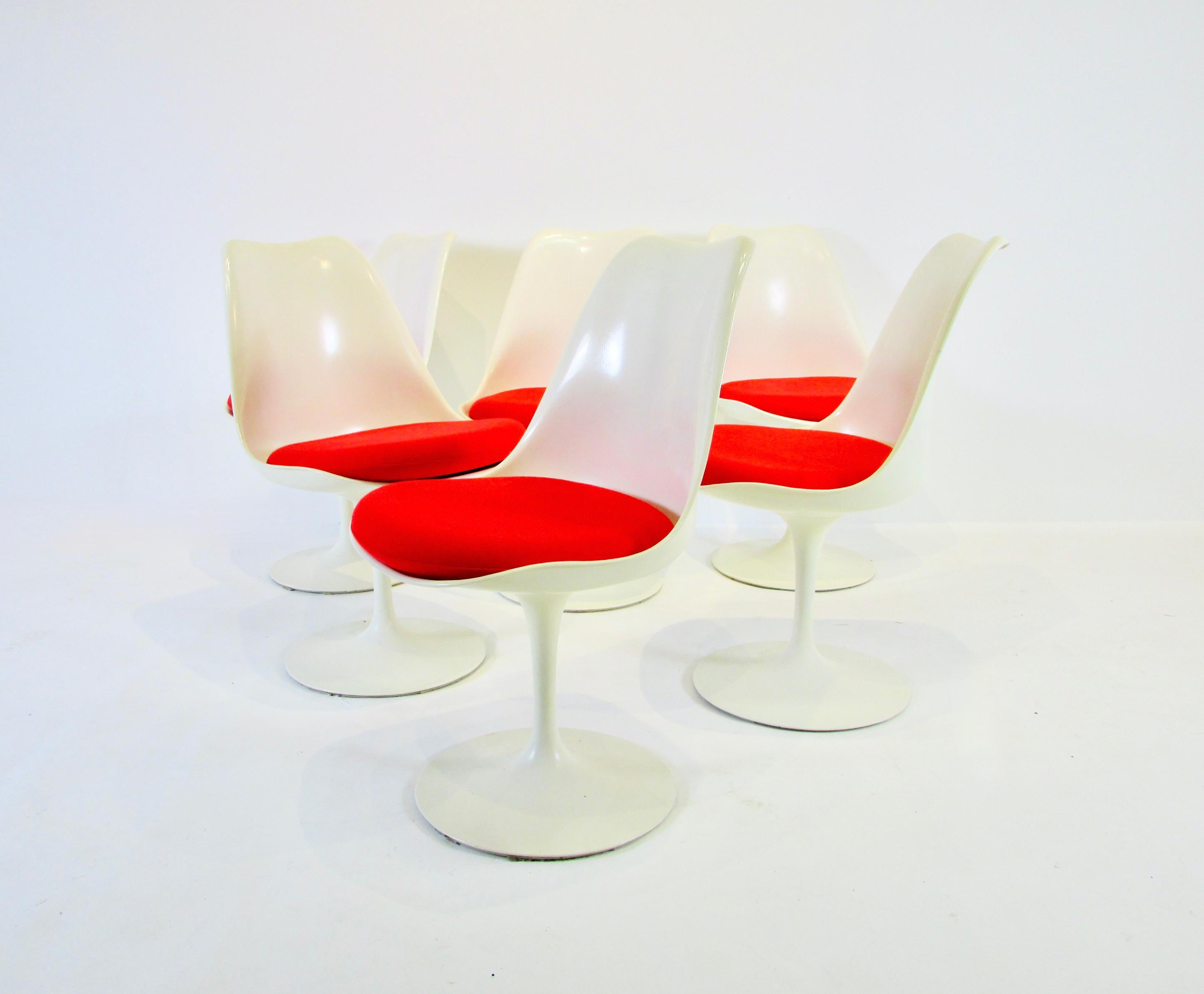 Very clean original set of six Tulip group chairs. Designed by Eero Saarinen for Knoll. White aluminum base supports white fiberglass shells with red Knoll textile . All very clean originals . 