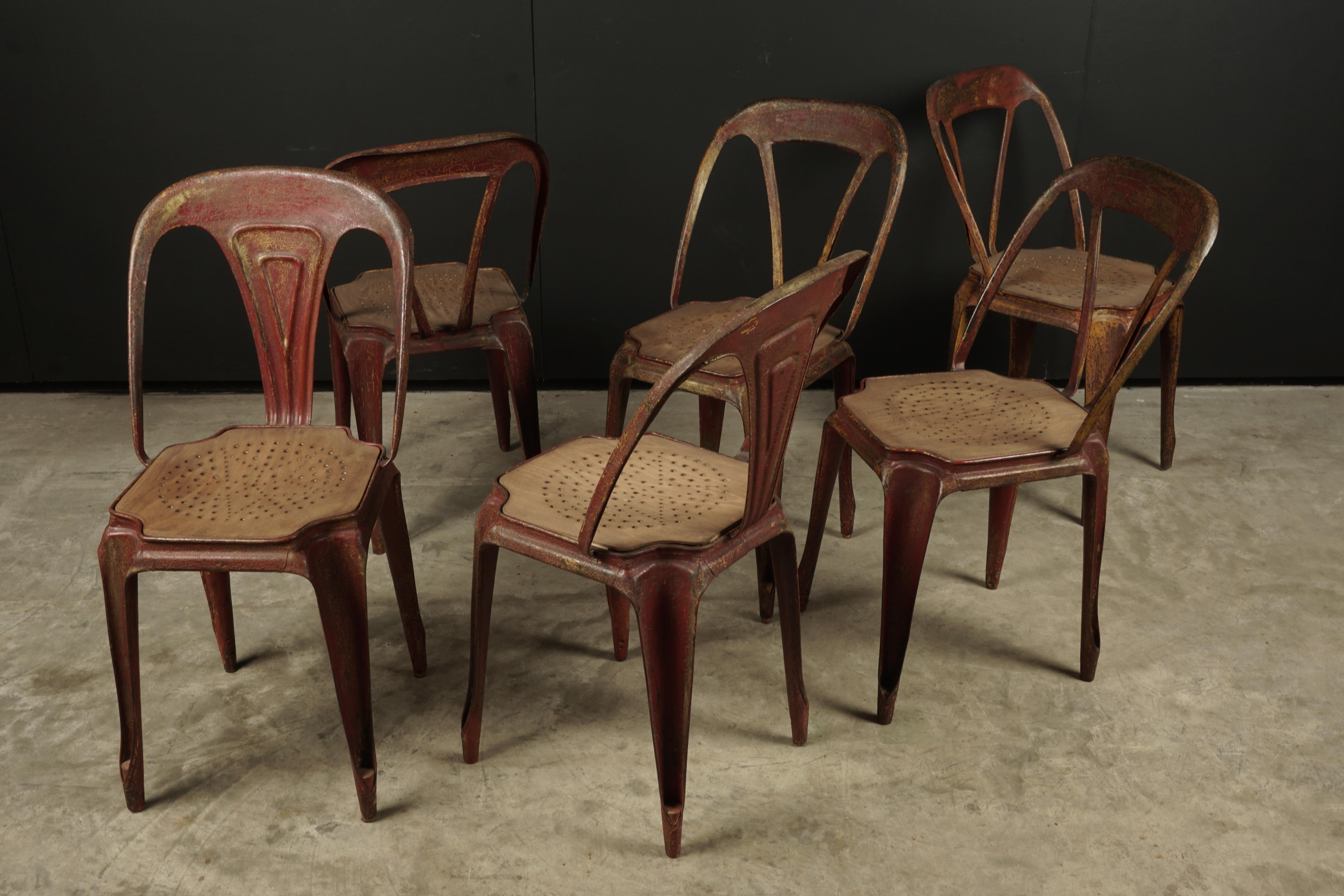 Vintage set of six Fibrocit bistro chairs, France, circa 1950. Fantastic original color and patina. Two have slightly different backs than the other four. Stackable.