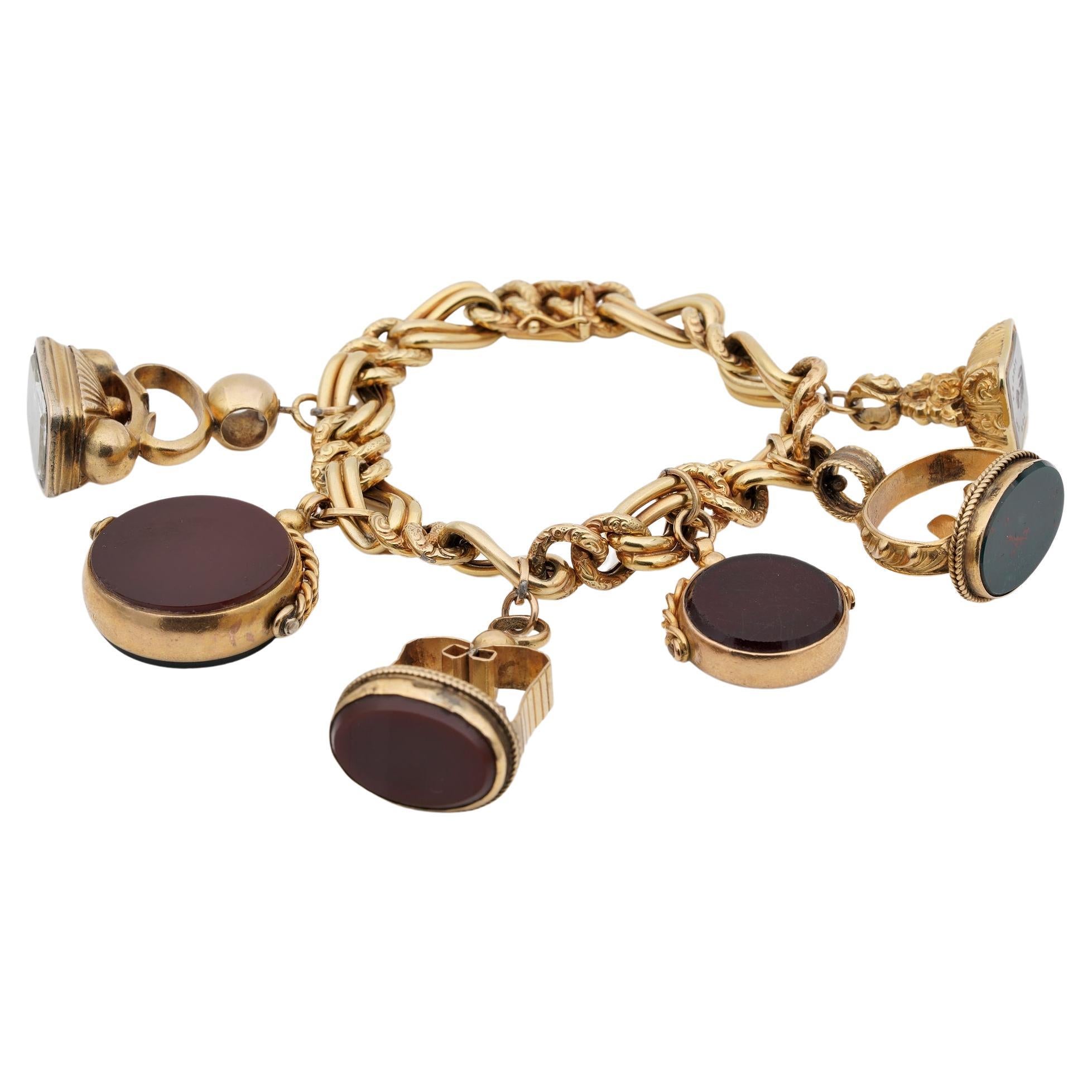 Six Fobs Charm Bracelet 9KT/14 KT Gold For Sale