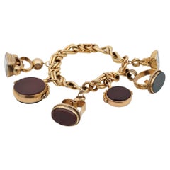 Six Fobs Charm Bracelet 9KT/14 KT Gold