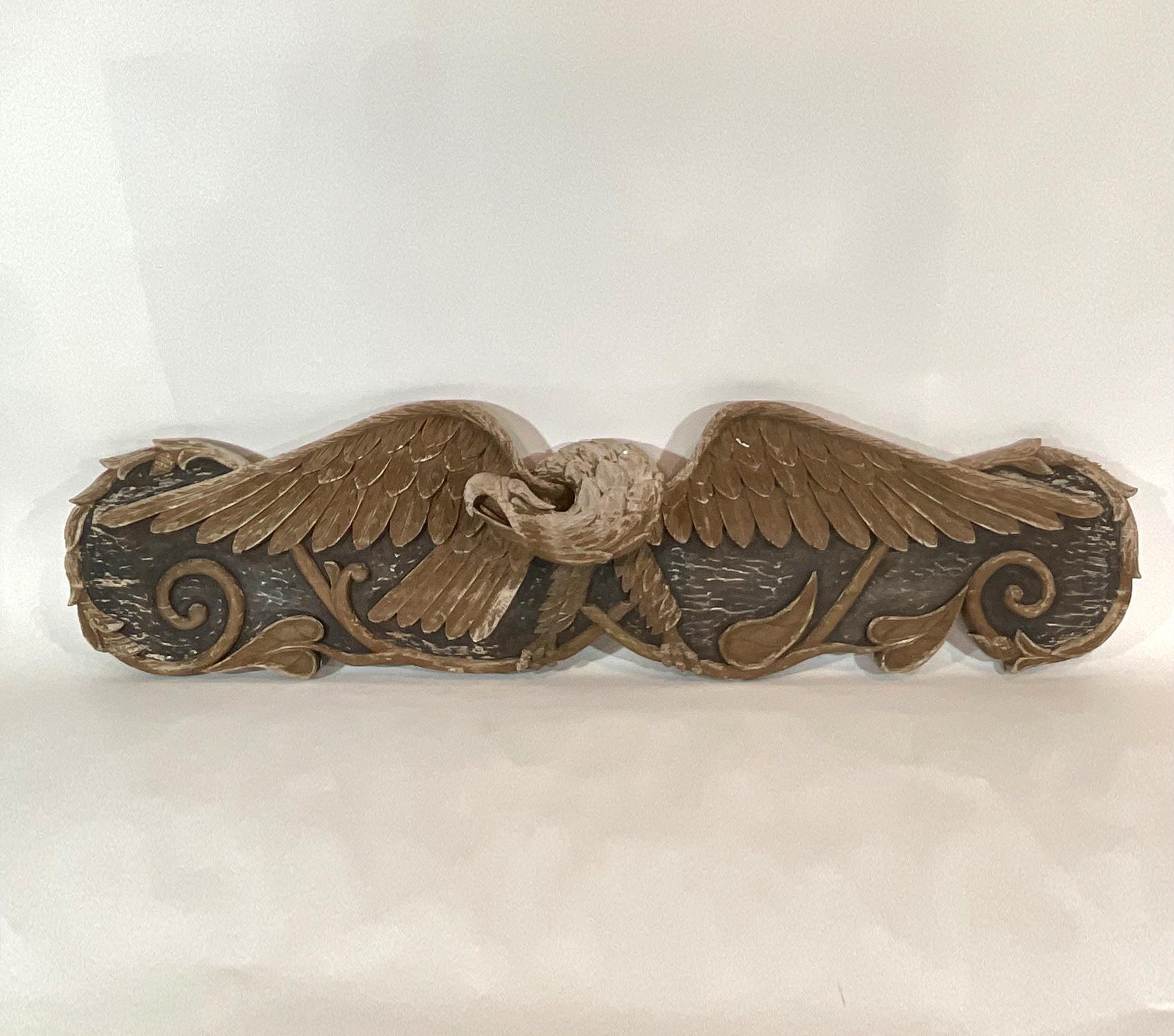 Great old late Nineteenth Century carved stern board eagle carving. Distressed finish. Finely executed probably by a Maine carver, possibly Bellamy.

Weight: 24 LBS
Overall Dimensions: 18” H x 72” L x 6” D
Made: America
Material: Wood
Date: