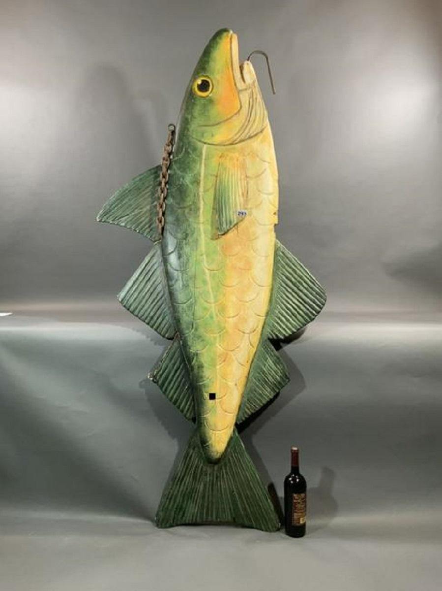 Six foot hand carved fish from England. Most recently from a local seafood restaurant. Nicely painted and carved showing fins, gills, mouth, eyes, etc.

Overall dimensions: Weight is 47 pounds. 32