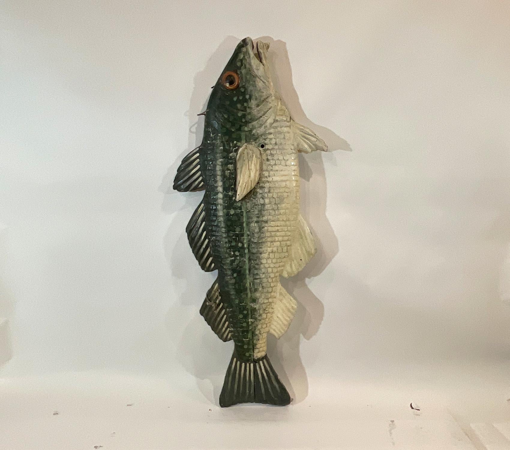 Carved wood fish from England. Six-foot fish with details including gills, fins, scales, snout, eyes, etc. Great finish in the style of the trade signs that the fishmongers would hang over their stalls in the English fish market