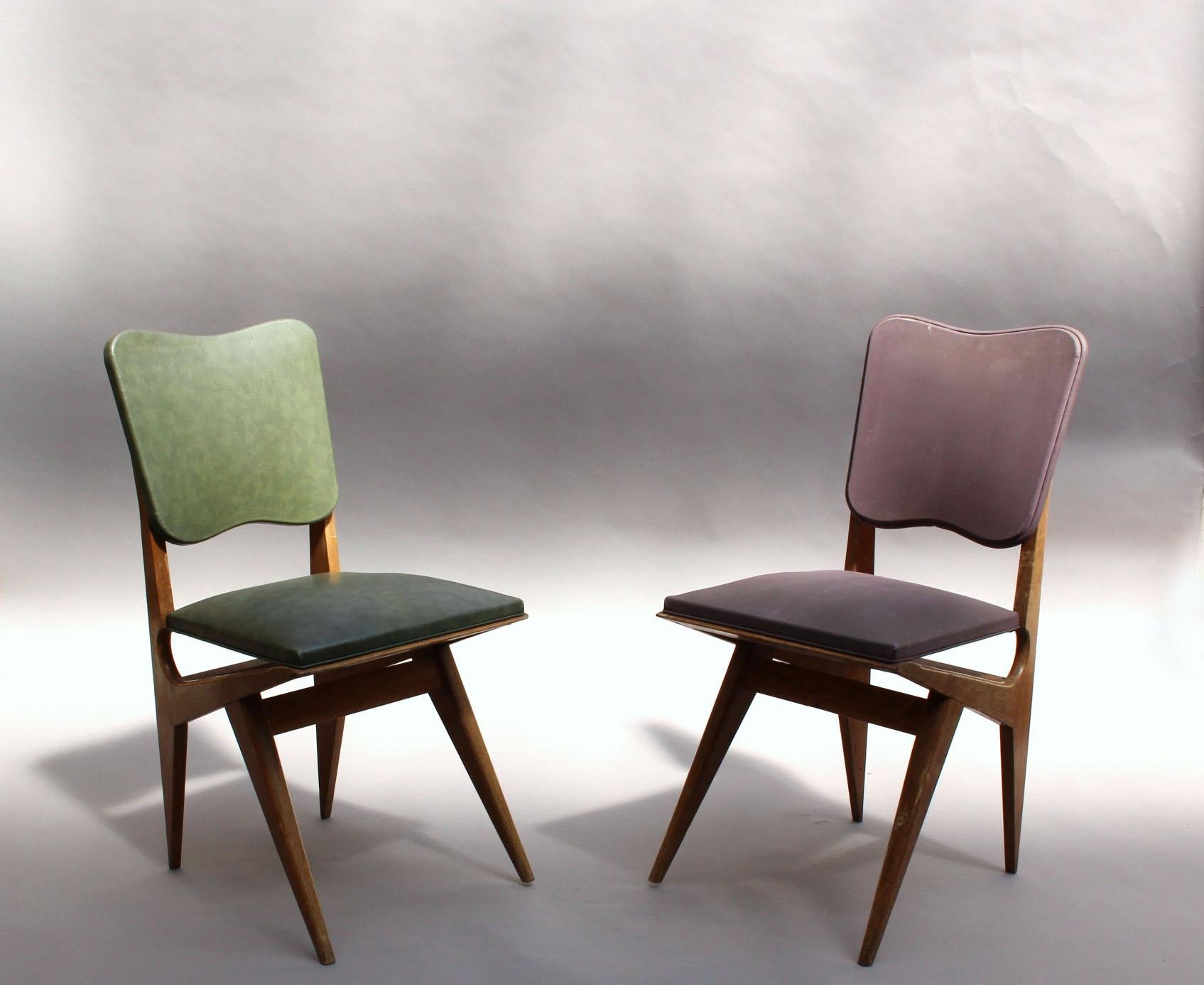Two French midcentury dining / side chairs in solid oak.