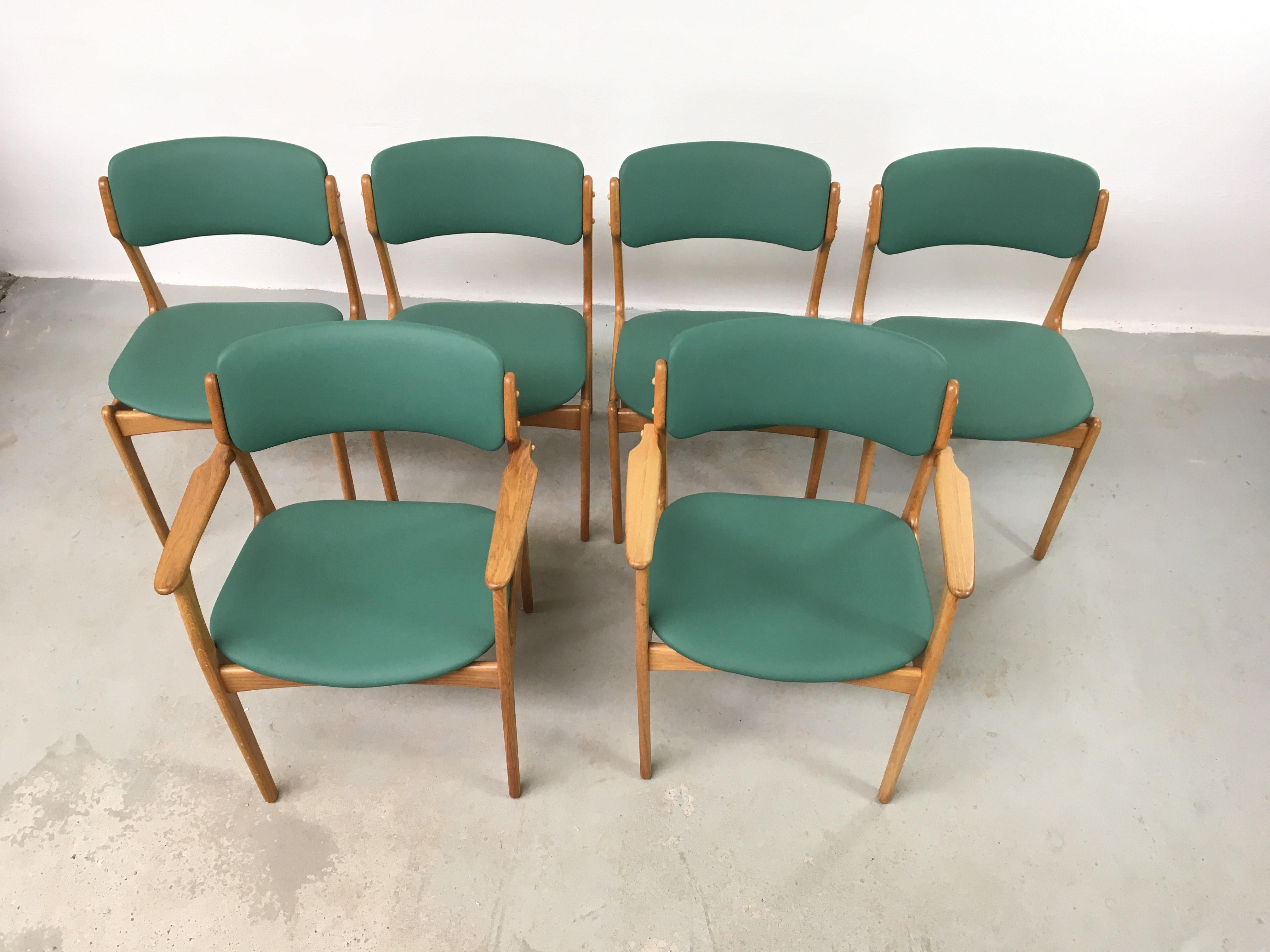 Six fully restored Erik Buch oak dining chairs, custom Reupholstery.

The set consists of 4 rosewood Erik Buch dining chairs and two rosewood Erik Buch armchairs with floating seats 

The chairs have a simple yet solid construction with elegant