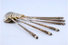 Six gilded silver teaspoons with twisted handles engraved Russian-style