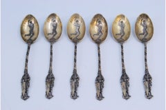 Six gilded souvenir spoons with Olympic athlete motifs and Antwerp reference