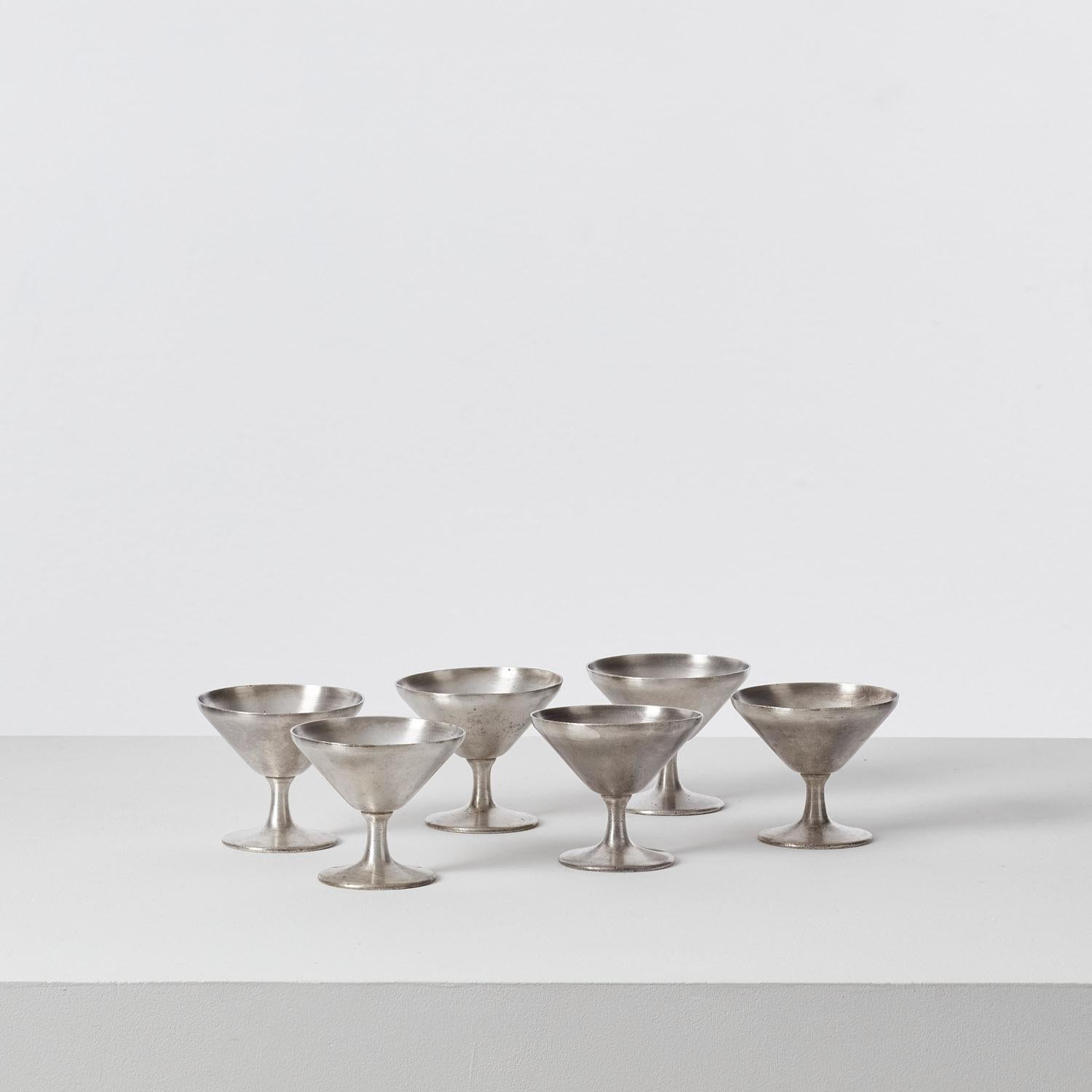 Pared back to its essential form, this set of silver plated six cups designed by Gio Ponti has a graceful simplicity in its silhouette. Designed for the Hotel Kursaal Rimini, the cups were produced with manufacturer Krupp Milano.

The six cups are