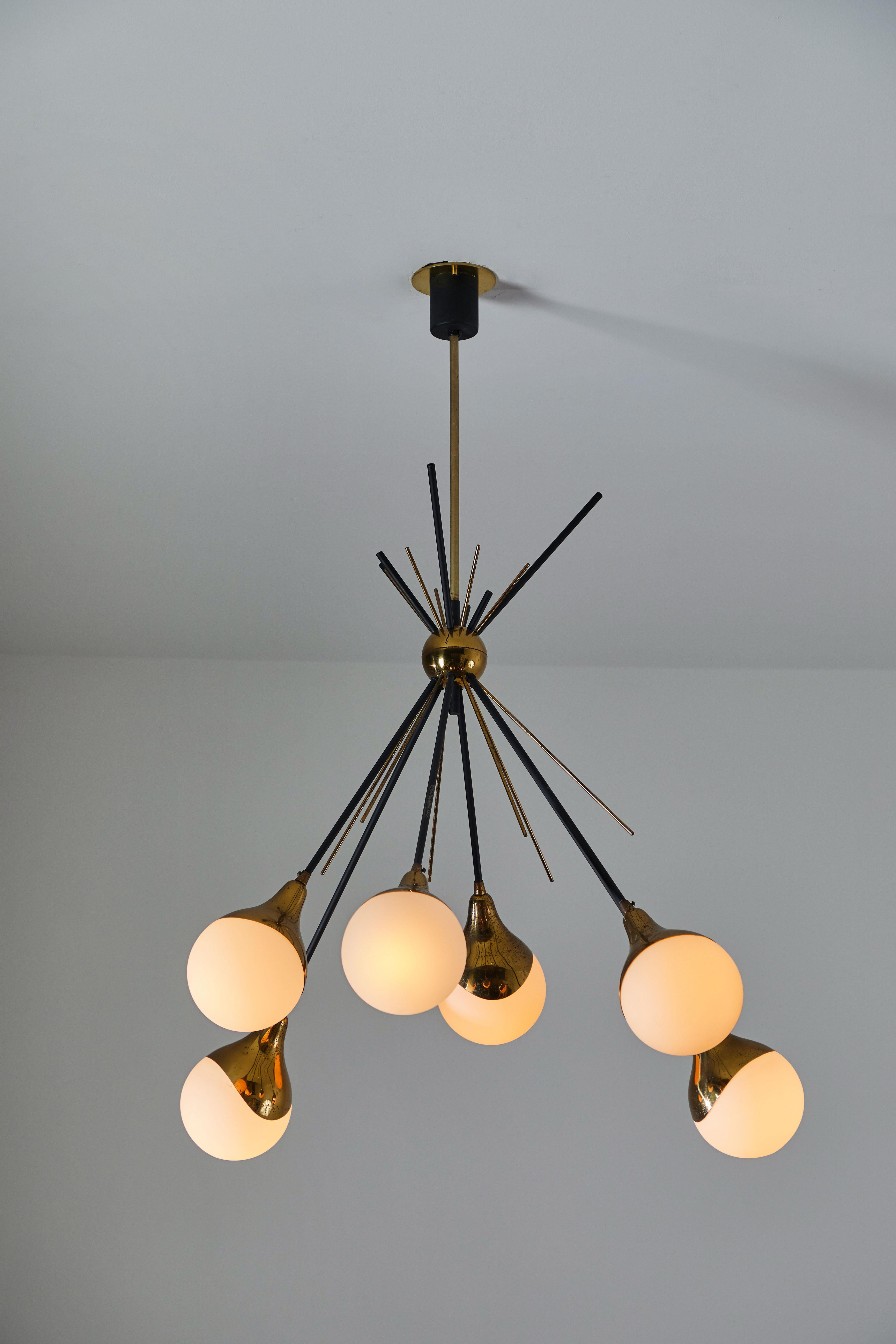 Six Globe chandelier by Stilnovo. Manufactured in Italy, circa 1950s. Brass, brushed satin glass diffusers, enameled metal. Custom brass ceiling plate. Original canopy. Rewired for US junction boxes. Takes six E14 25w maximum bulbs.