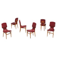 six Guglielmo Ulrich chairs with wooden structure and skai coverings Italy 1950s