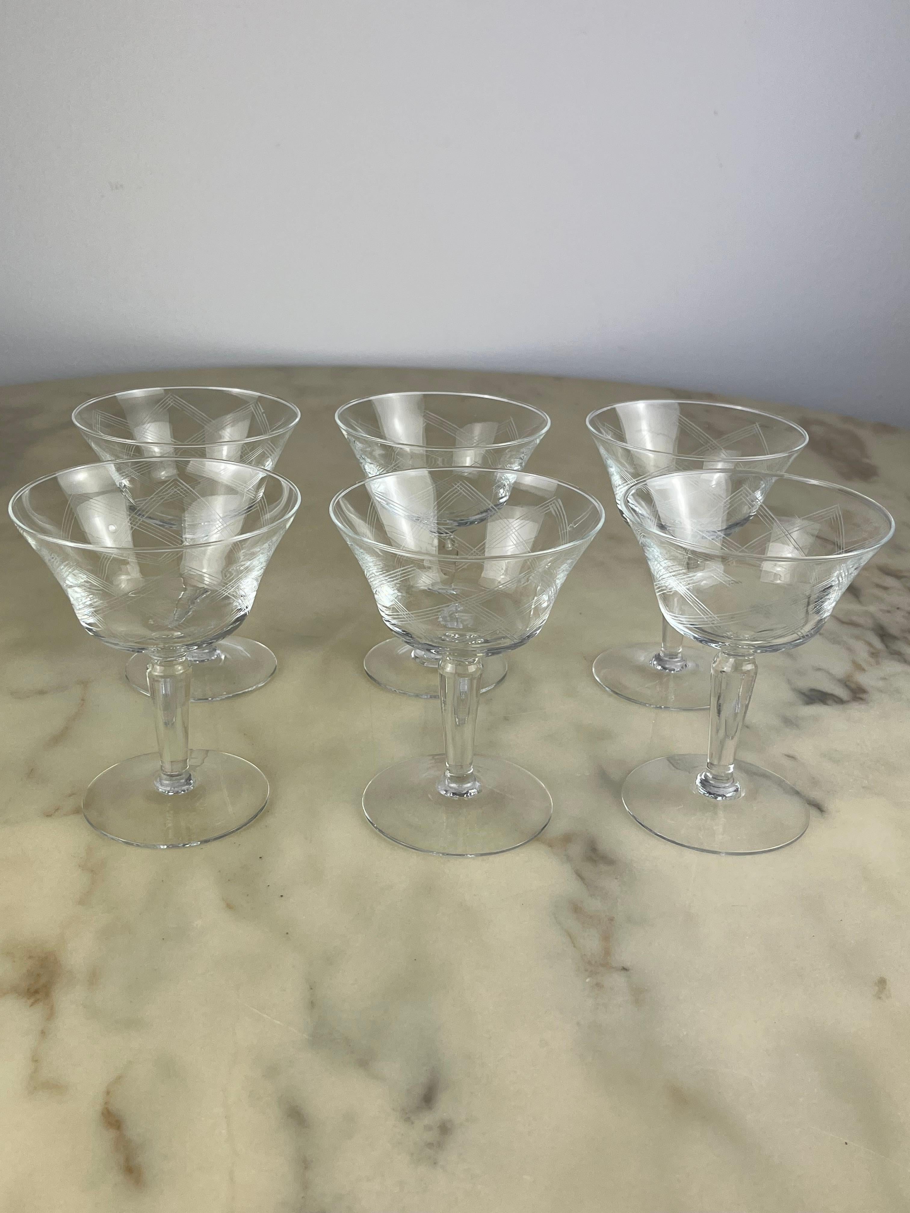 Six hand engraved crystal champagne glasses, Italy, 1960s.
They belonged to my great-grandmother, they are in perfect condition and intact.
Each has a small bubble, typical of handcrafted glass processing.