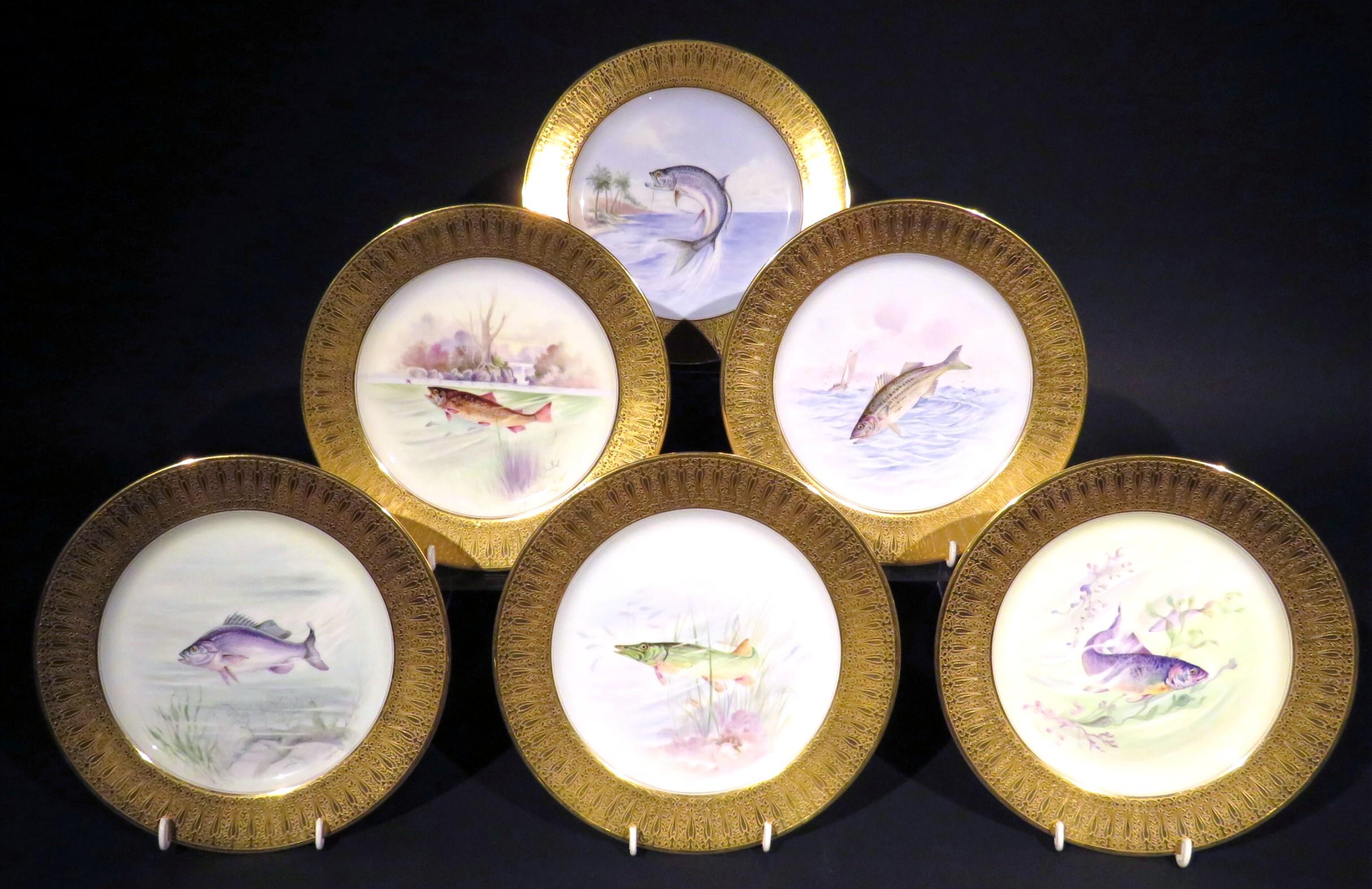 An exquisite set of six hand painted Lenox porcelain cabinet plates by artist Eugene DeLan (working 1896-1915), previously retailed by Tiffany & Co. Each plate showing a richly embossed gilt border surrounding a central field decorated with a