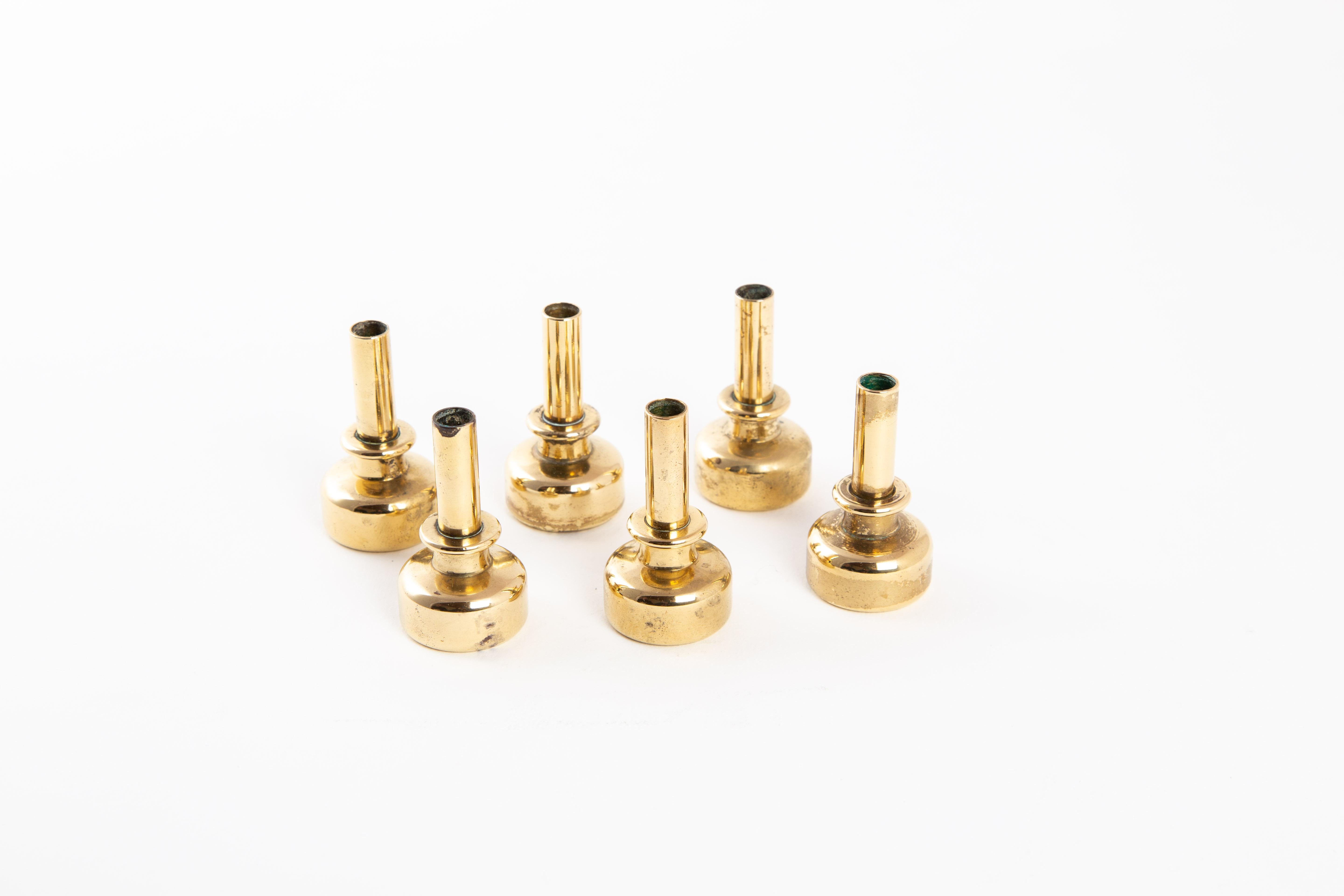 A set of six candleholders in brass designed by Hans-Agne Jakobsson in Sweden. Marked on the bottom.