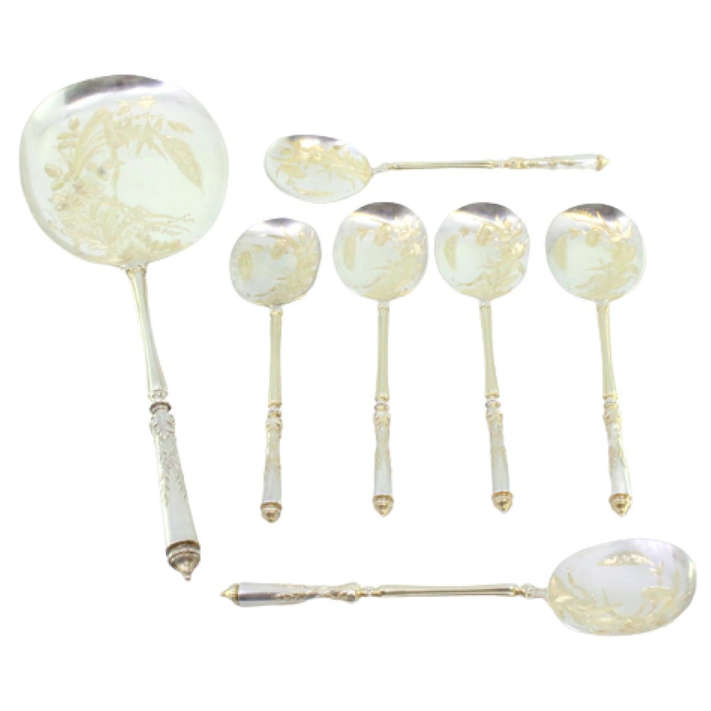 Six ice-cream scoops and shovel in gilt silver with floral-engraved shells