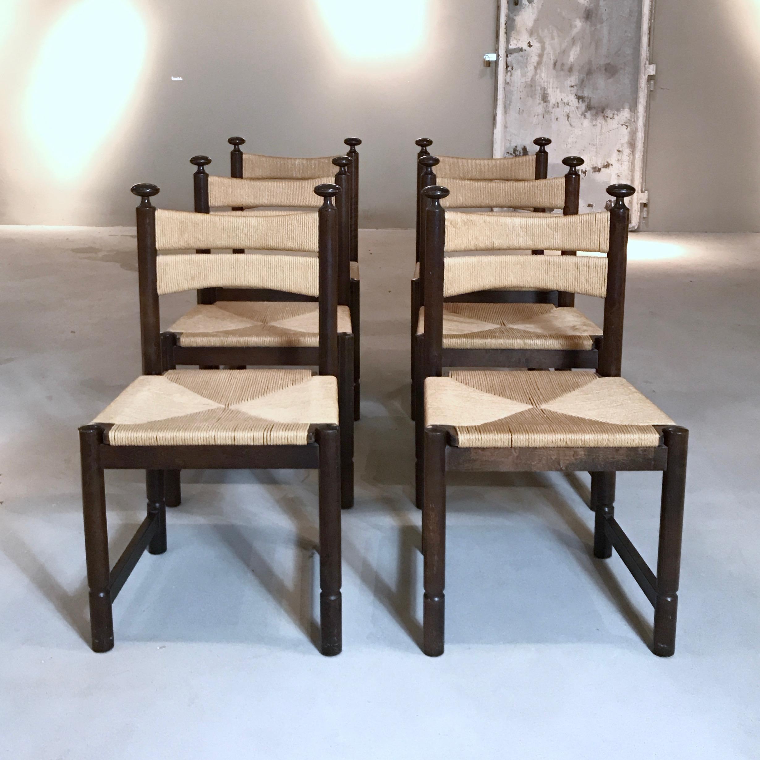 Rare Asko chairs designed by Ilmari Tapiovaara, Finland, 1960s. The chairs have a solid walnut wood frame with woven rush seating. The chairs are in good original condition with minor wear due to age and usage. Labeled with the Asko Export decals on